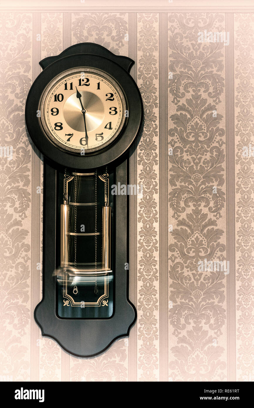 Wall mounted wooden pendulum clock hi-res stock photography and images ...