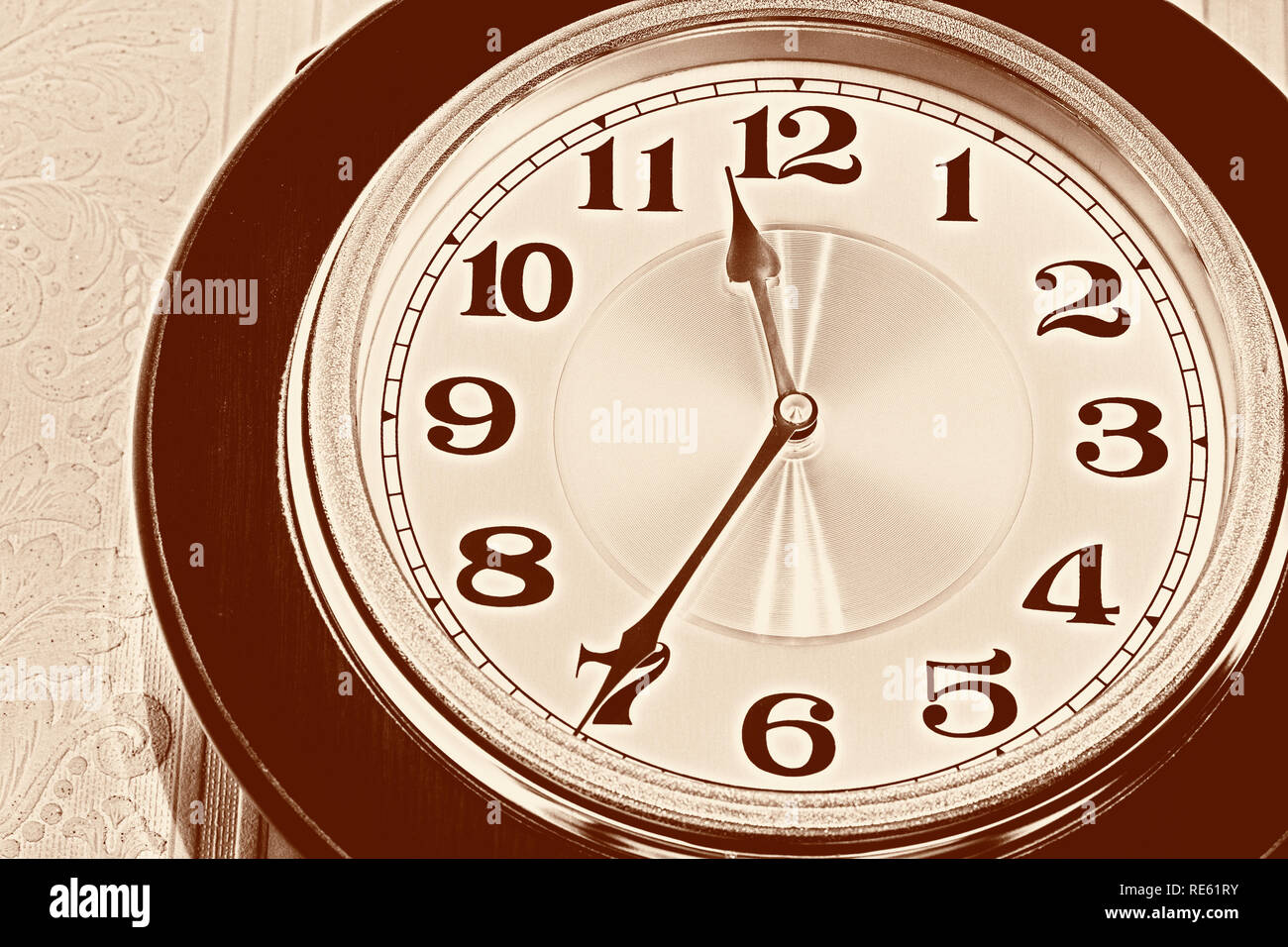 Wall pendulum clock with the fight in the old style. Stock Photo