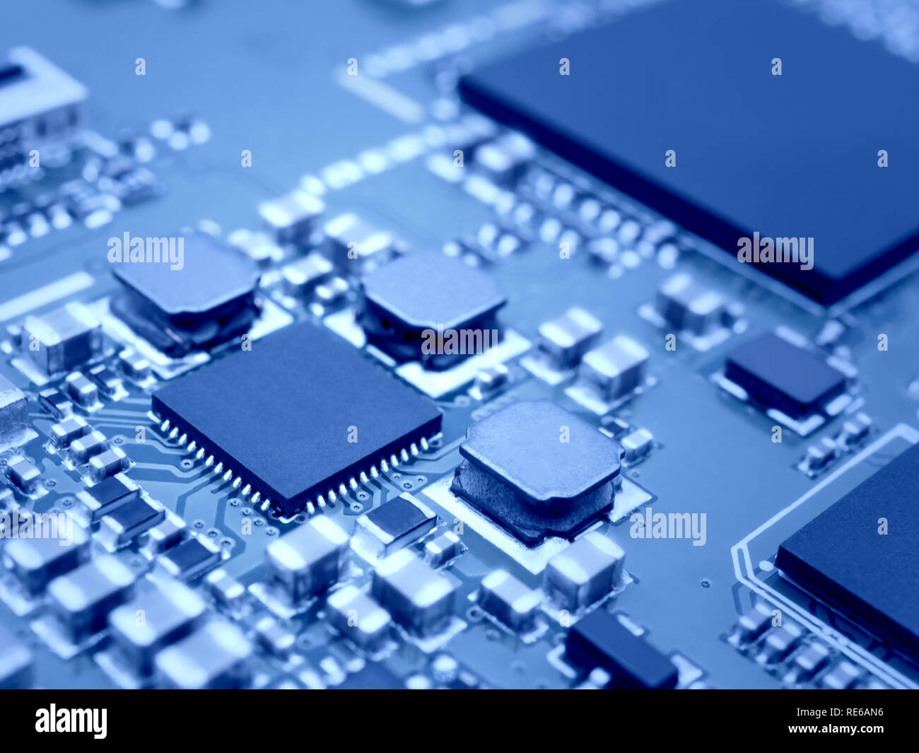 Closeup image of microprocessor on electronic circuit board. Blurred ...