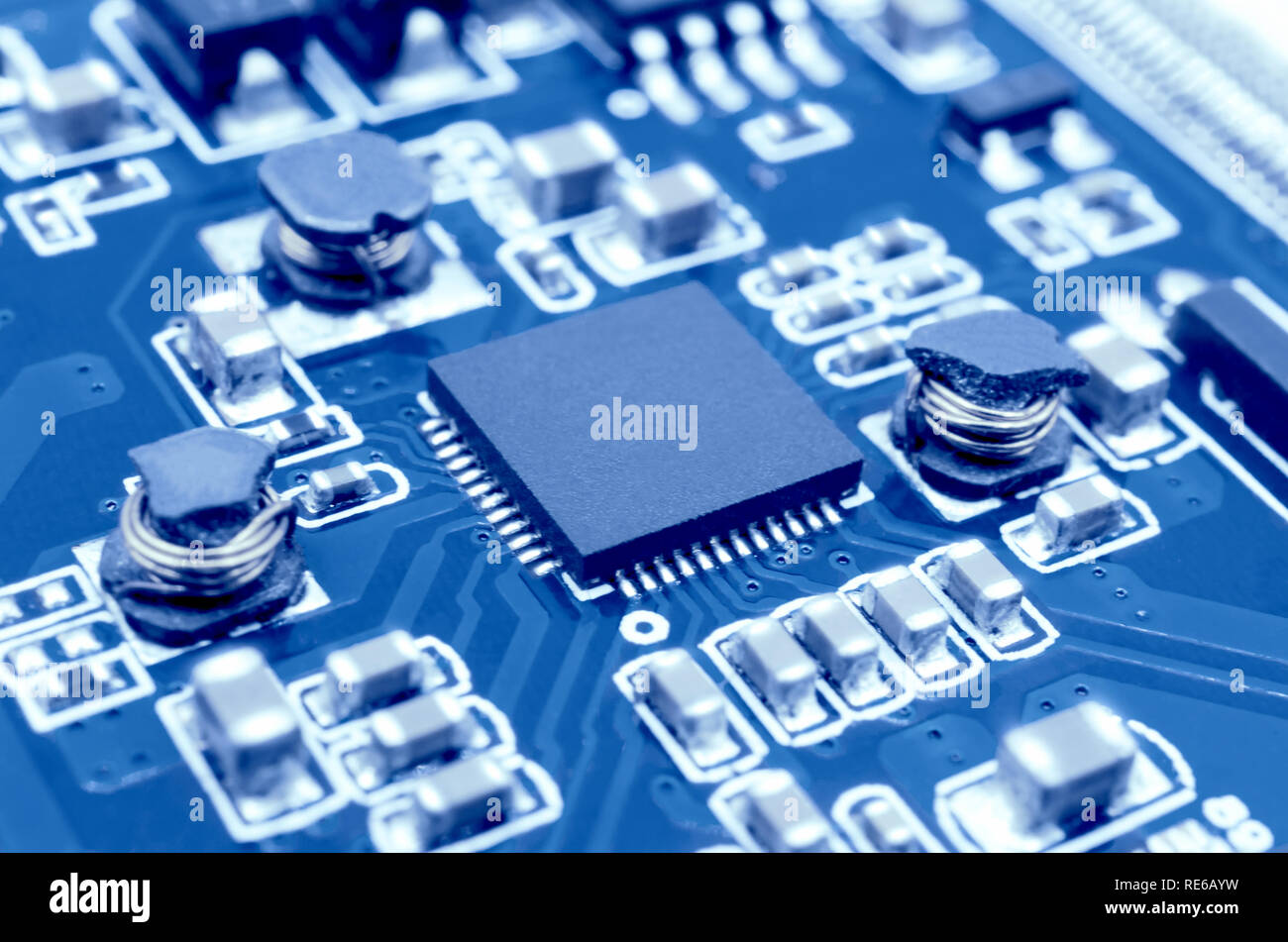 Closeup image of microprocessor on electronic circuit board. Blurred ...