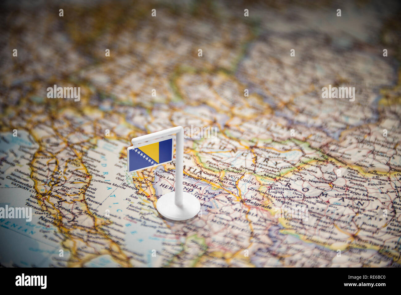 Bosnia and Herzegovina marked with a flag on the map Stock Photo