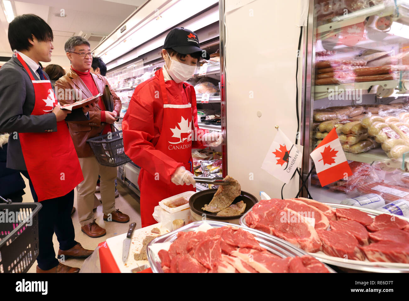 Tokyo, Japan. 20th Jan, 2019. A woman grills a slice of Canadian beef for tasting at a sales promotional event for Canadian beef as Japan's tariff of imported beef will be reduced from 38.5 percent to 9 percent in 16 years at the Nissin World Delicatessen supermarket in Tokyo on Sunday, January 20, 2019. Canadian International Trade Minister James Carr is now here to attend the first ministerial meeting of the Comprehensive and Progressive Agreement for Trans-Pacific Partnership (CPTPP). Credit: Yoshio Tsunoda/AFLO/Alamy Live News Stock Photo