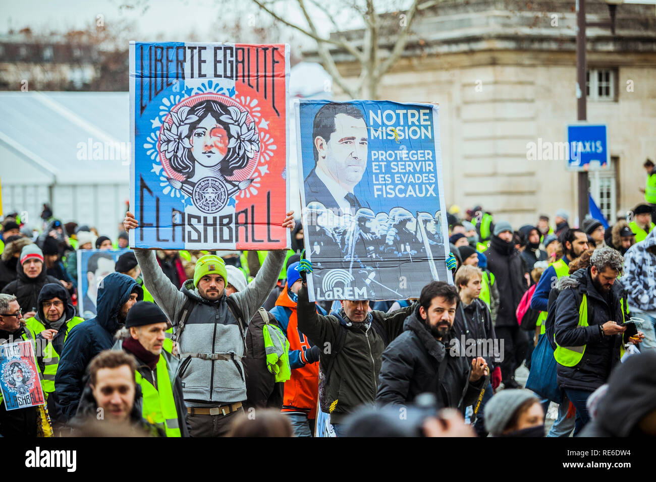 Paris, France. 19 Jan 2019.Thousands of yellow vests (Gilets Jaunes) protests in Paris calling for lower fuel taxes, reintroduction of the solidarity tax on wealth, a minimum wage increase, and Emmanuel Macron's resignation as President of France. Credit: Norbu Gyachung/Alamy Live News. Stock Photo