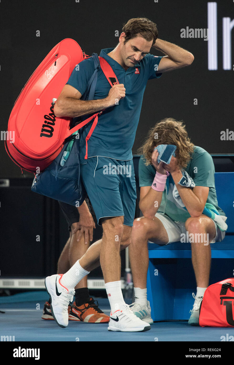 Melbourne, Australia. 20th Jan, 2019. Roger Federer of Switzerland (L)  walks past Stefanos Tsitsipas of Greece after the men's singles 4th round  match at the Australian Open in Melbourne, Australia, Jan. 20,