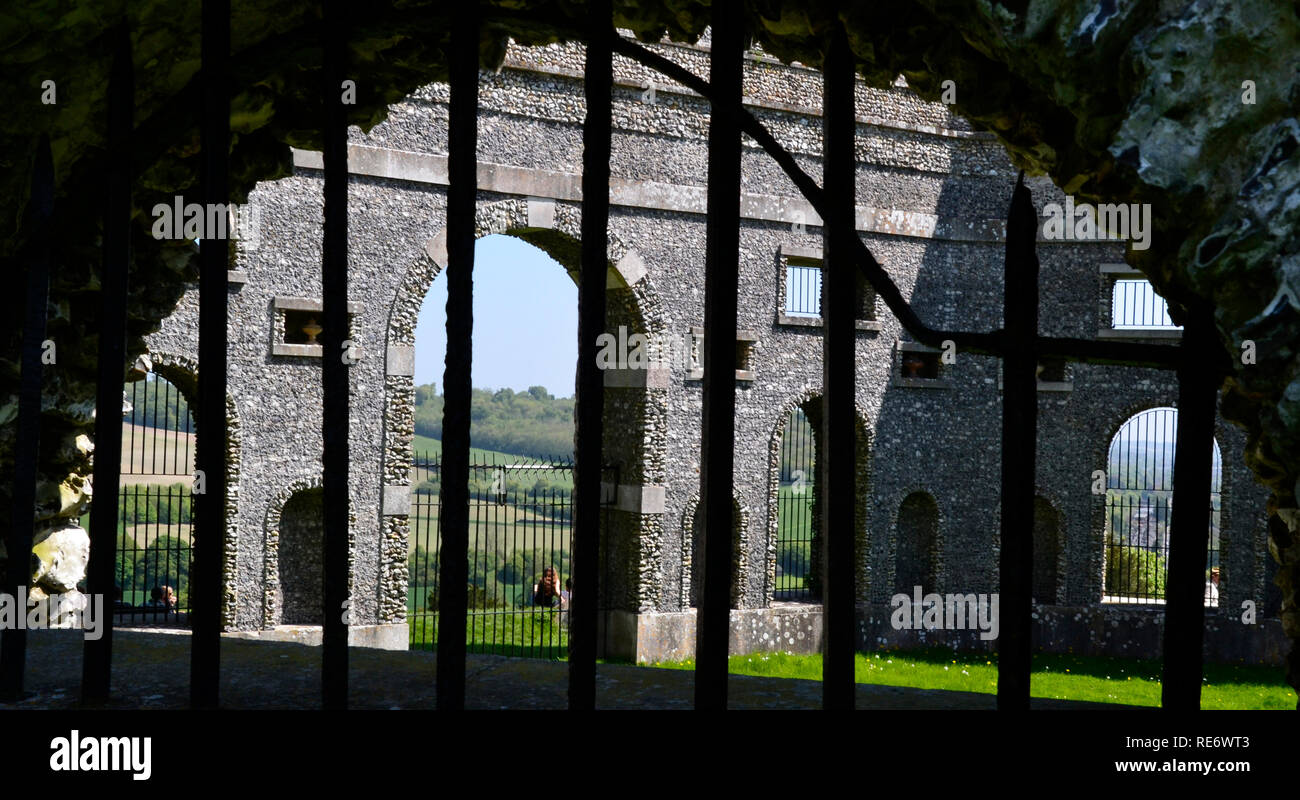 View of The Dashwood Mausoleum in West Wycombe, from behind an arch in the Church of St Lawrence Graveyard. Buckinghamshire, UK. Chilterns. Landscape. Stock Photo