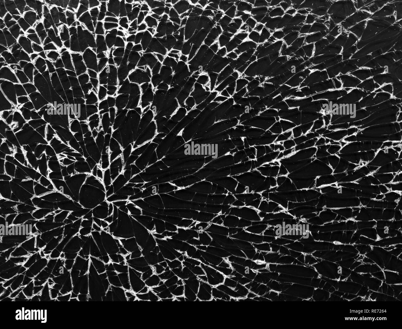 Cracked glass texture on black background. Isolated realistic cracked glass effect. Stock Photo