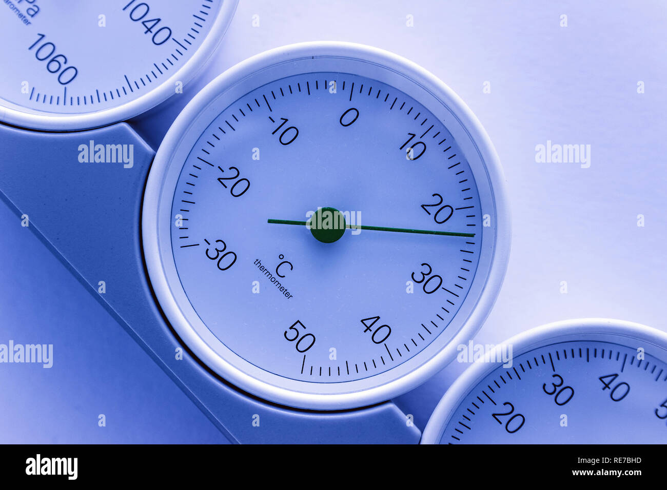 modern, round barometer, thermometer, hygrometer. Analog device for measuring humidity, temperature and atmospheric pressure. Stock Photo