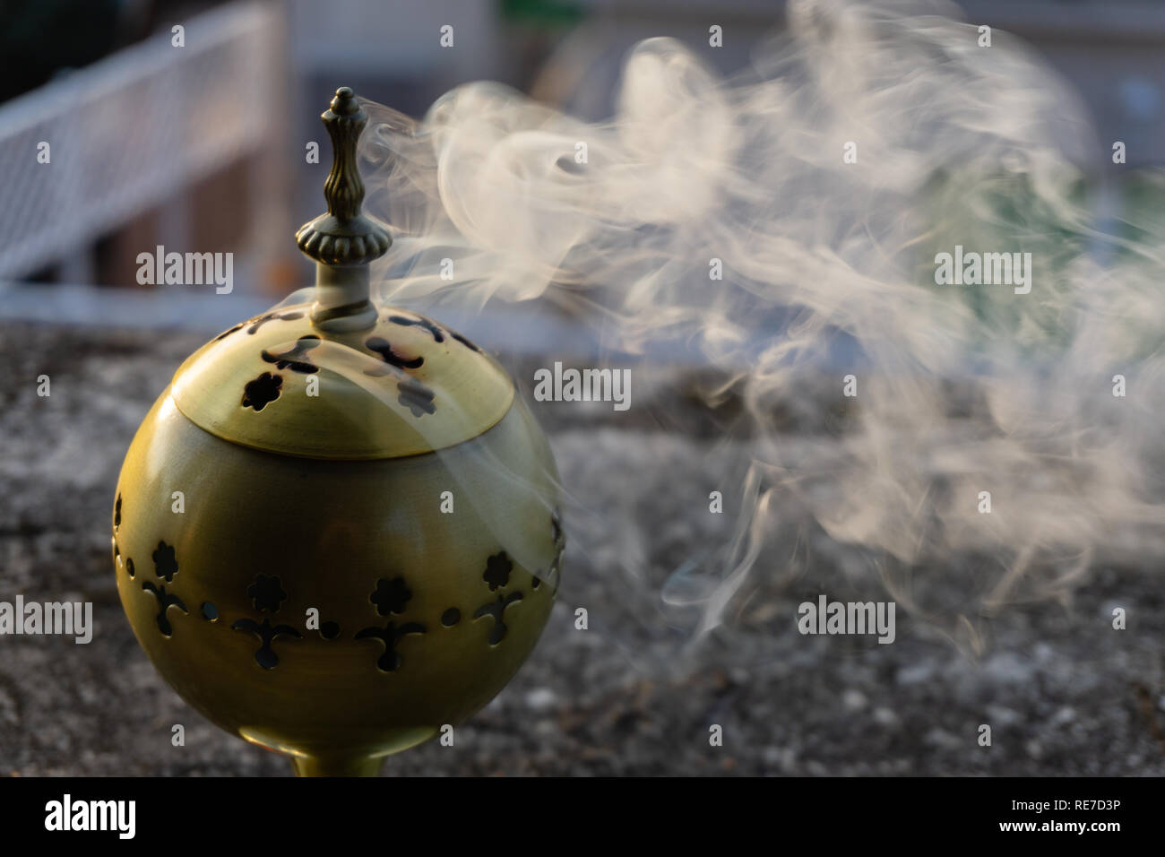 incense burner censer with smoke and blurred background Stock Photo