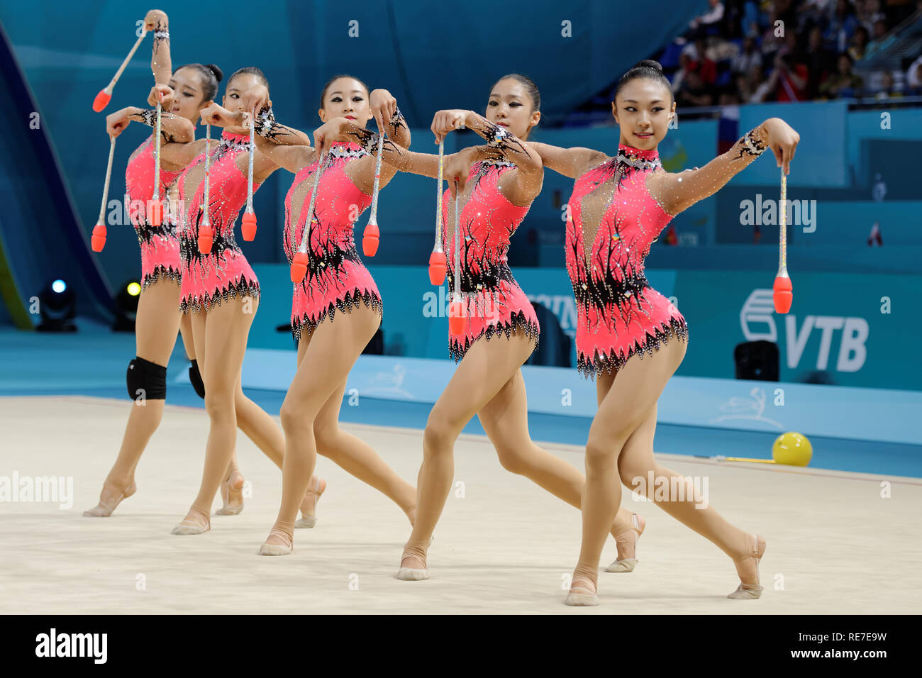 Kiev, Ukraine - August 31, 2013: Team Korea performs with clubs during 32nd Rhythmic Gymnastics World Championships. The event is held in the Palace o Stock Photo