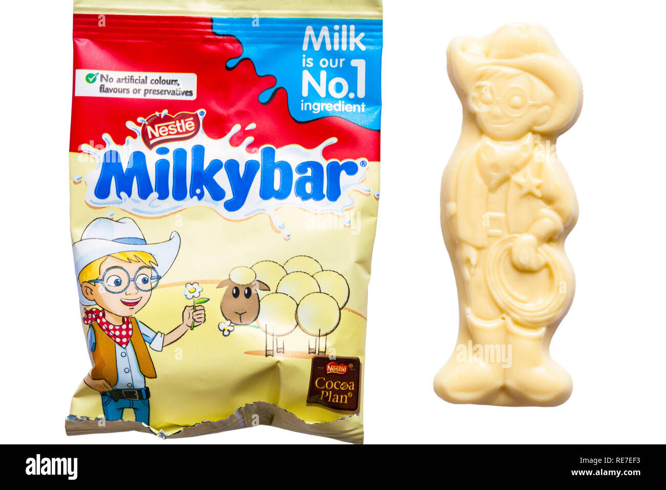 milkybar small bar unwrapped showing Milkybar Kid and bag of milky bar white chocolate buttons from Nestle Milkybar selection pack on white background Stock Photo