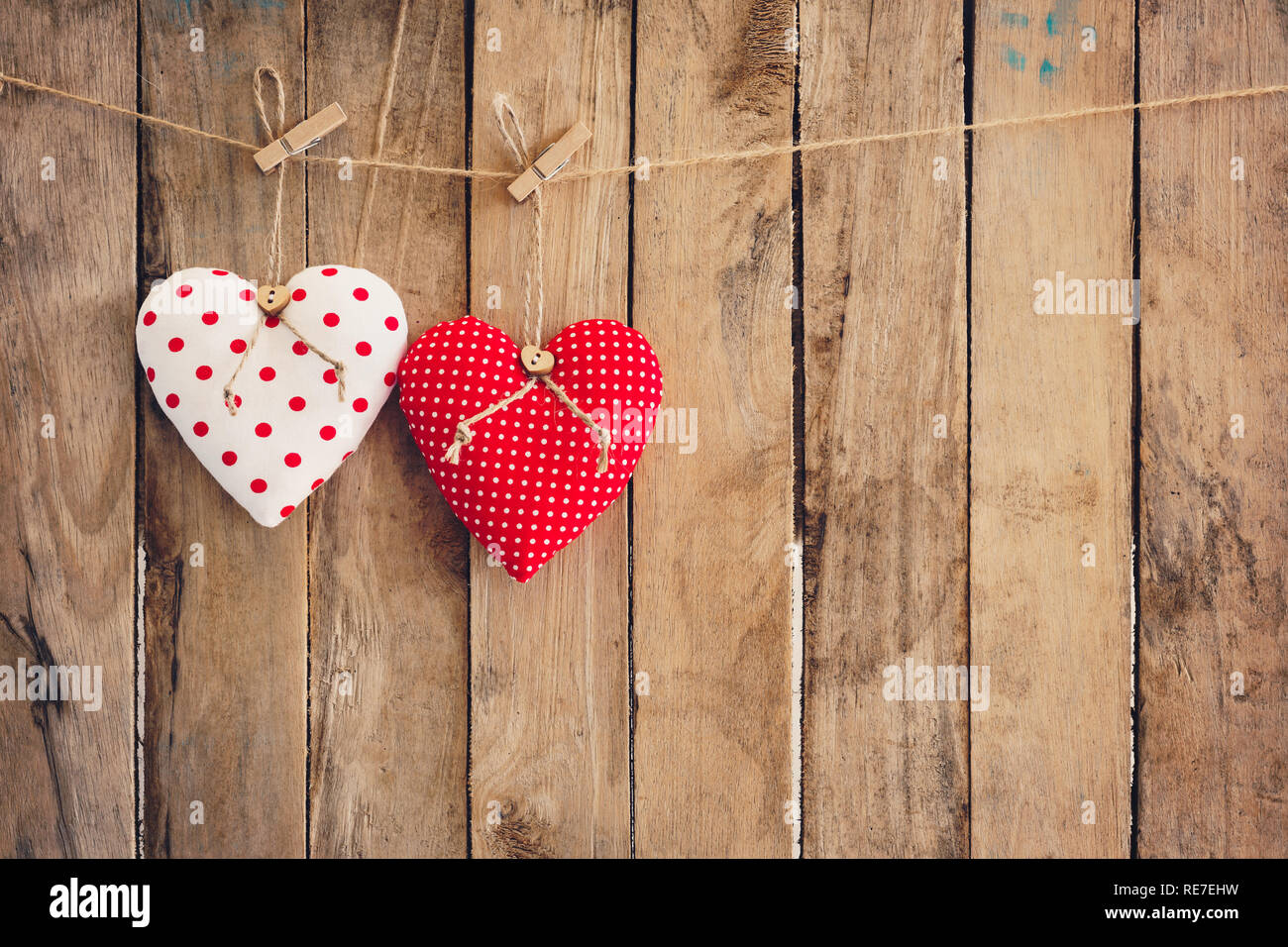 Heart hanging on wood background with copy space Stock Photo - Alamy