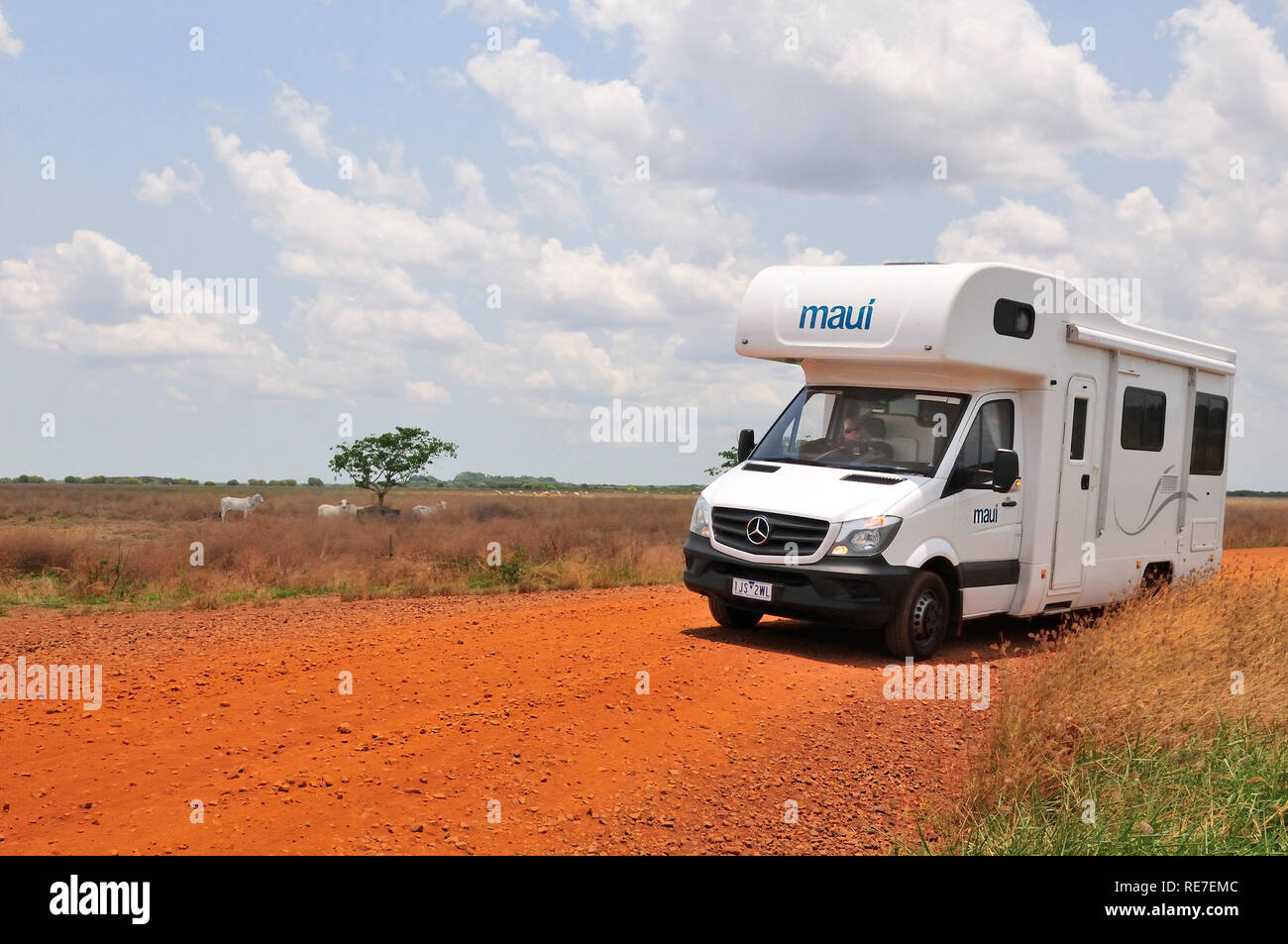 Campervan on red earth dirt road in the Northern Territory near Darwin, Australia Stock Photo