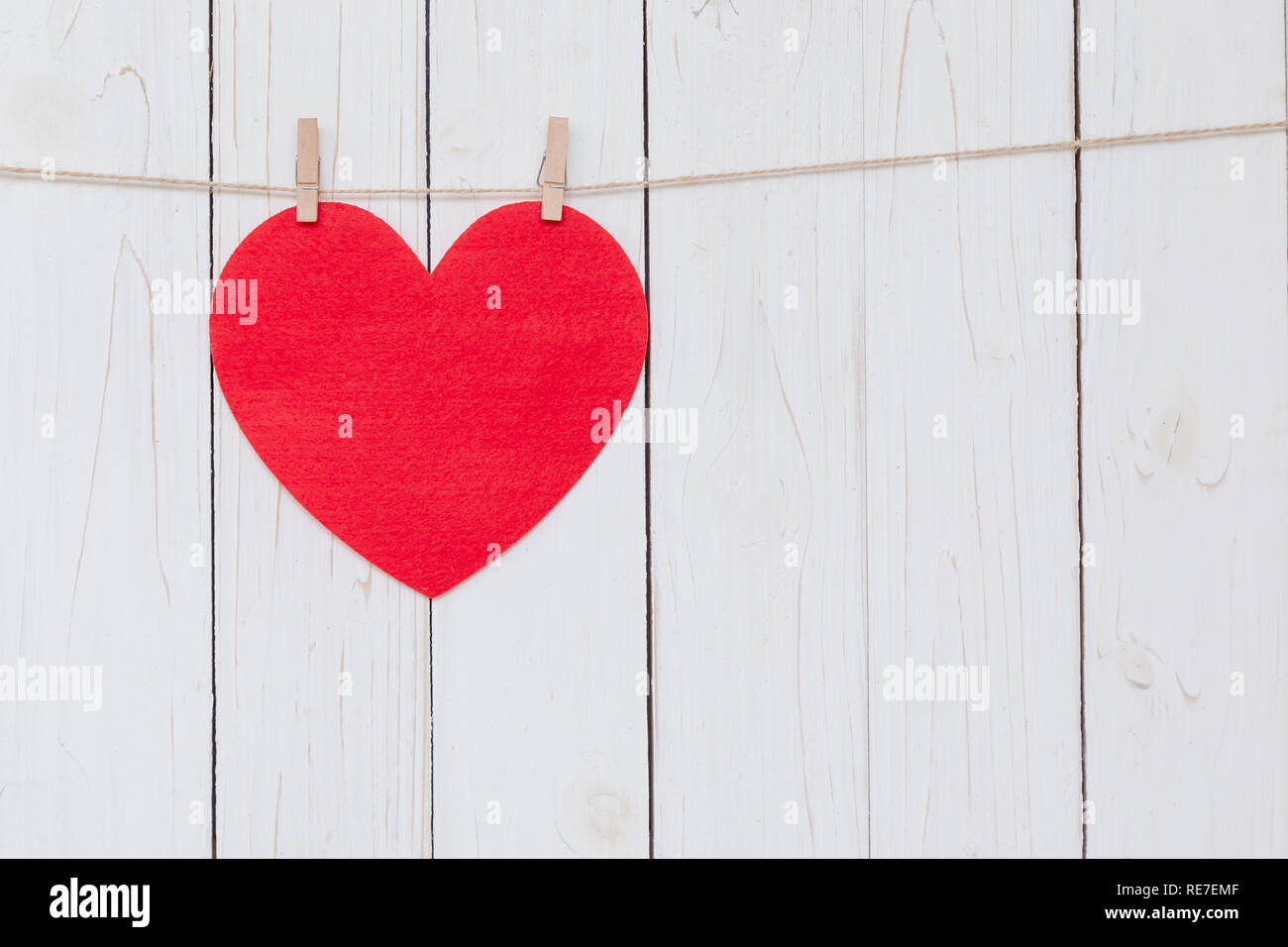 Red heart hanging on white wood background with copy space Stock Photo ...