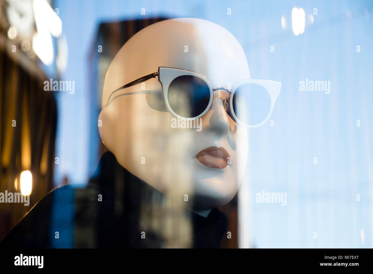 Belgrade, Serbia - Januar 17, 2019: One mannequin doll with sun glasses displayed n the shop window of Max Mara clothing expensive and elegant brand w Stock Photo