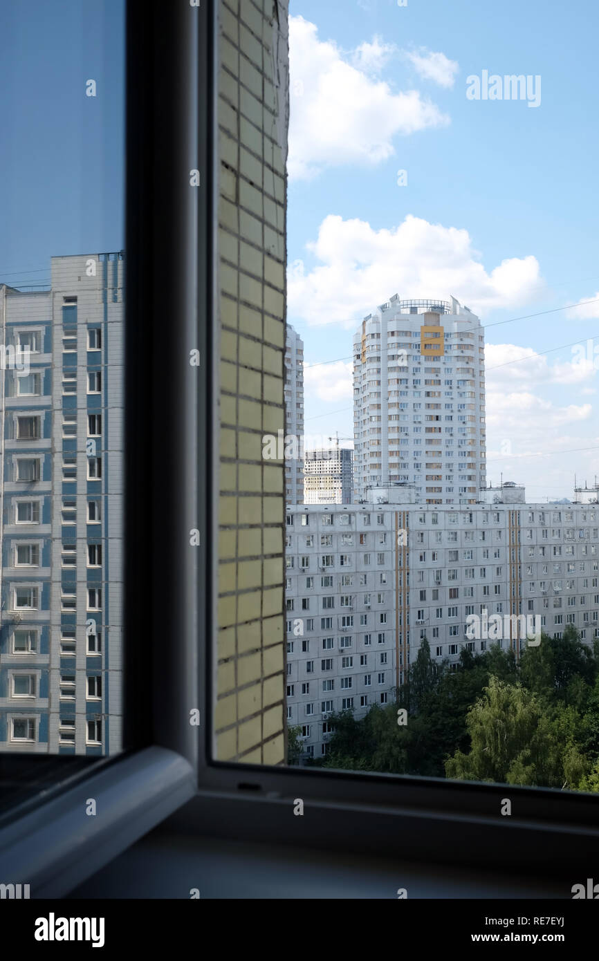 Curated visual reference: Fresh Look at View From Opened Window On Cityscape With Dense Urban Development