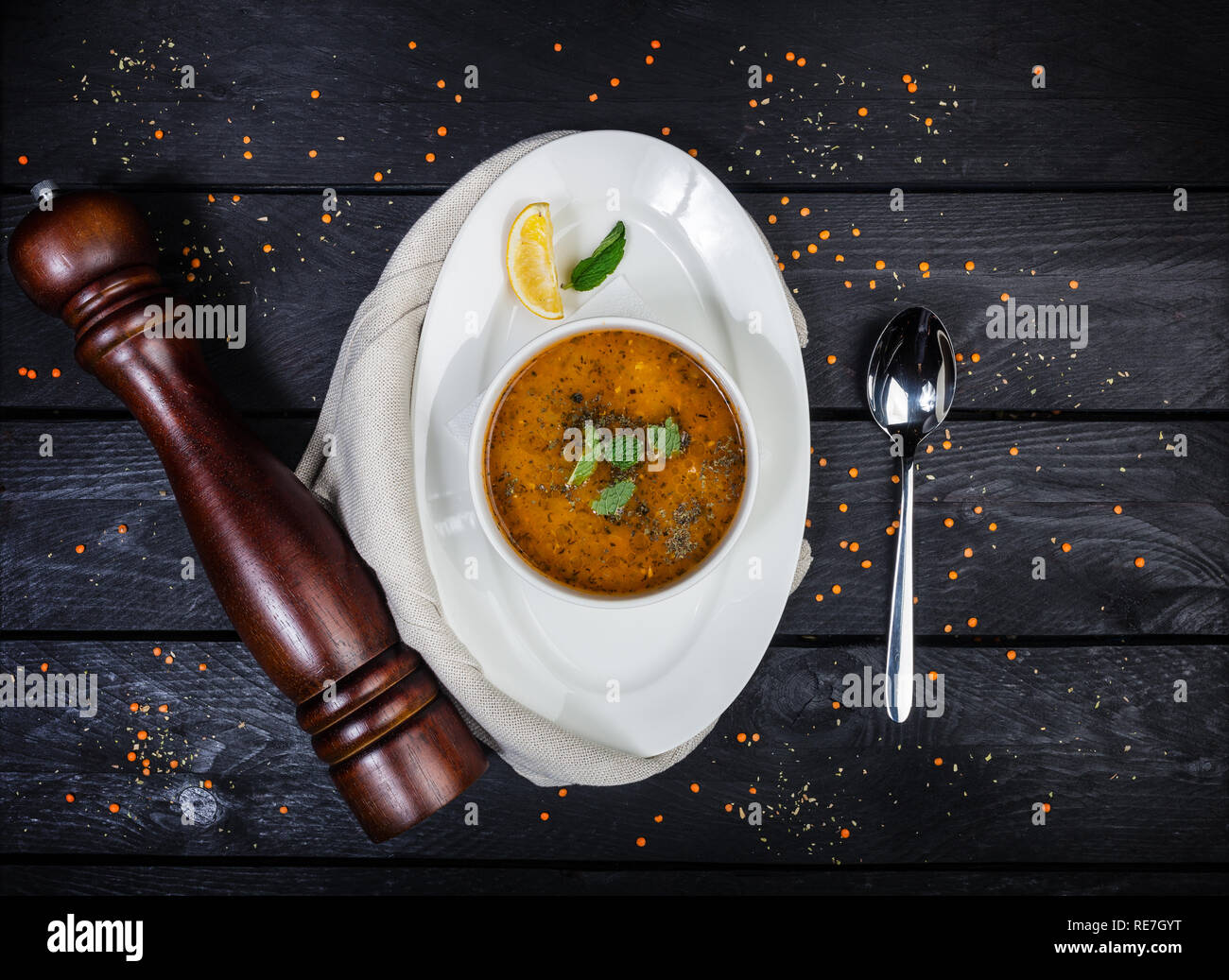 Red lentil soup served in white bowl Stock Photo