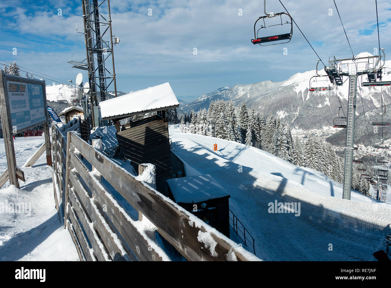 The Mouilles Chairlift Transporting Skiers up the Ski Slopes to the Le Pleney Gondola Area in Mountains above Morzine Ski Resort Haute Savoie France Stock Photo