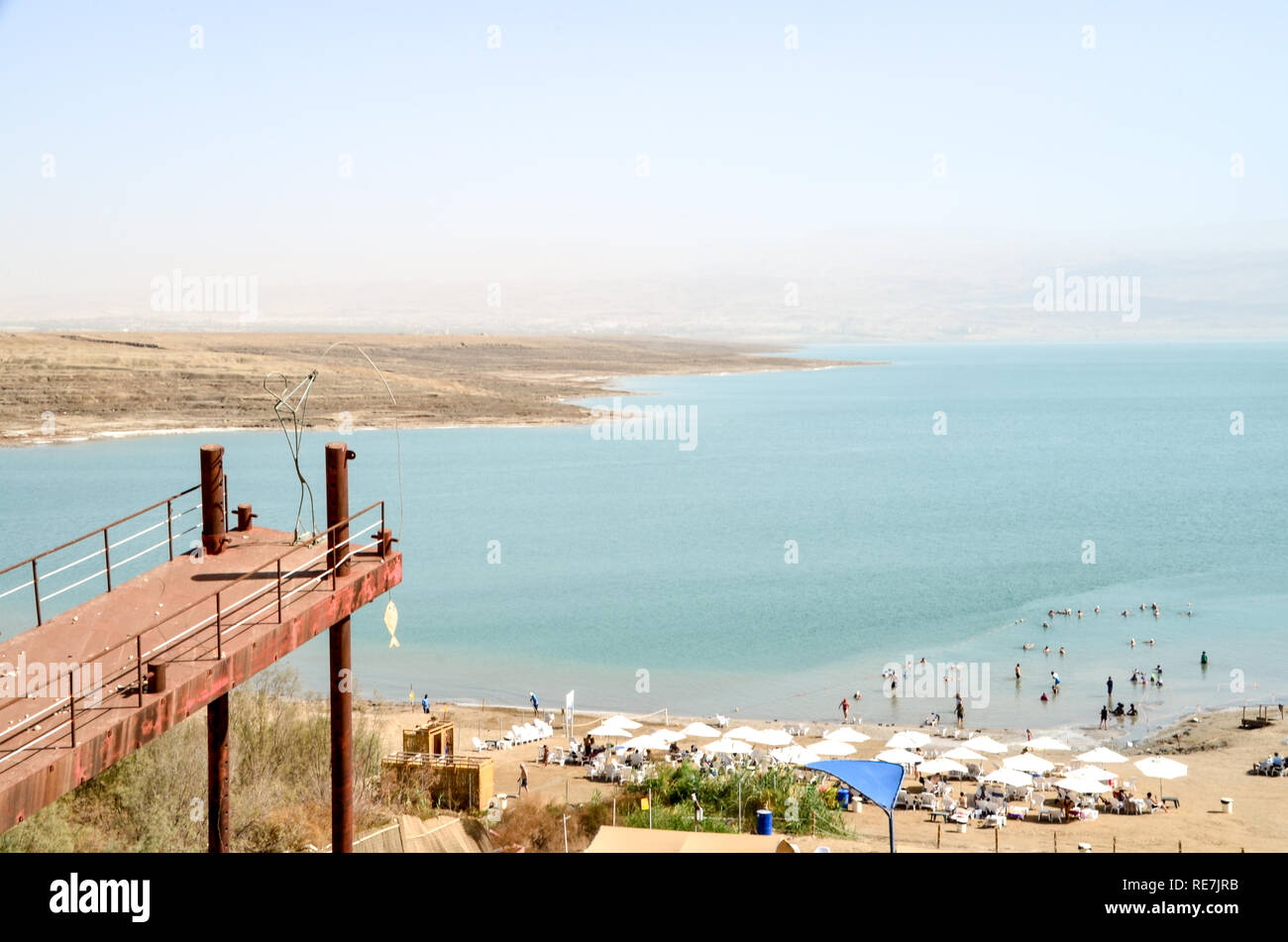 Jetty with fisherman sculpture at the Dead Sea (West Bank), hypersaline and lowest lake in the world, at -430m below sea level Stock Photo
