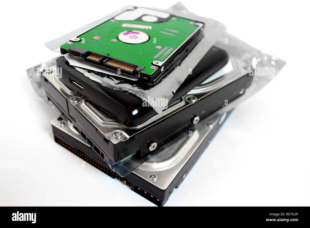 Pile of hard discs, 3.5 hdd, 2.5hdd, external hdd, anti static bag Stock Photo