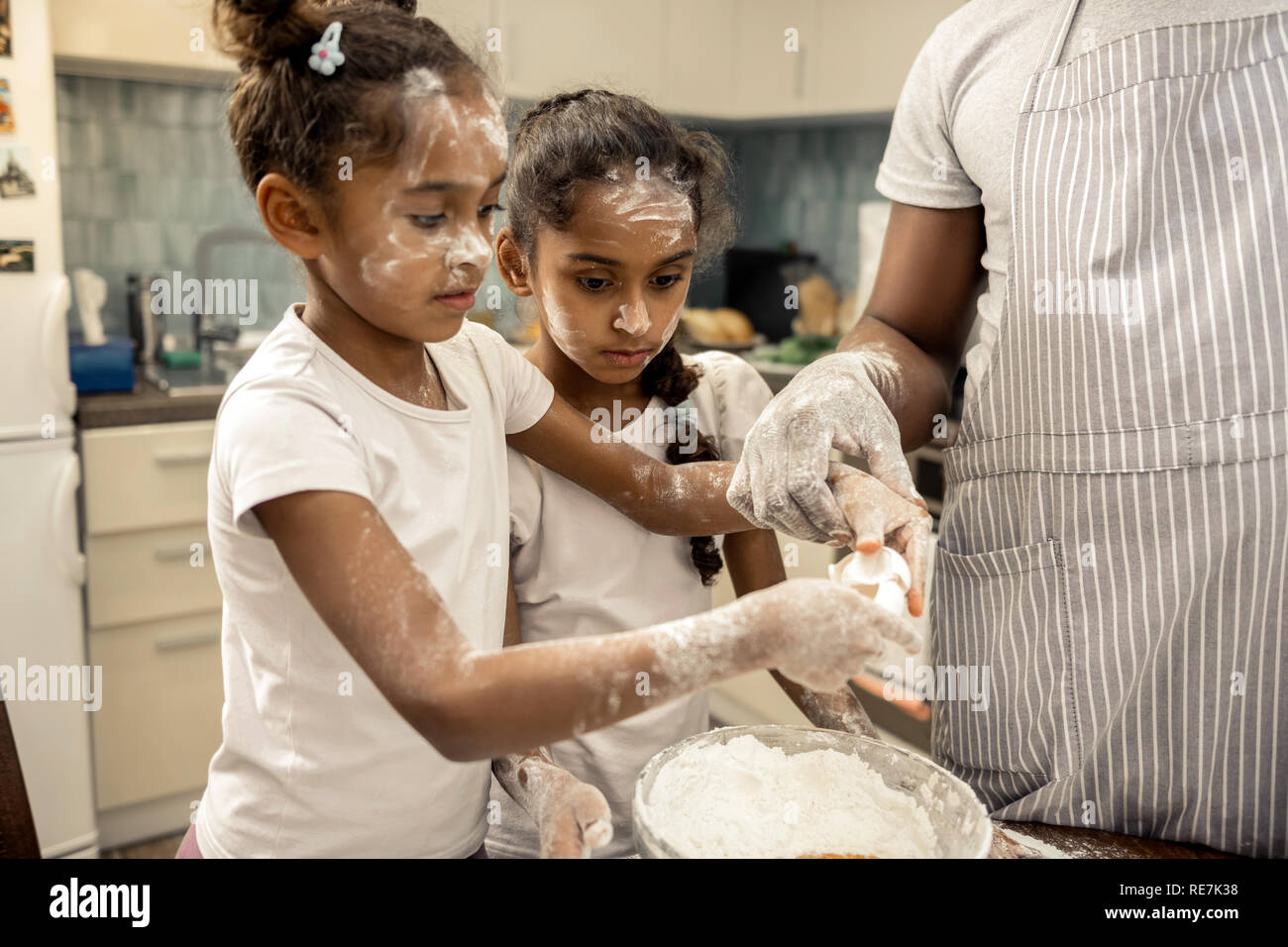 Two Funny Girls With Nice Hairstyles Cooking Together At The