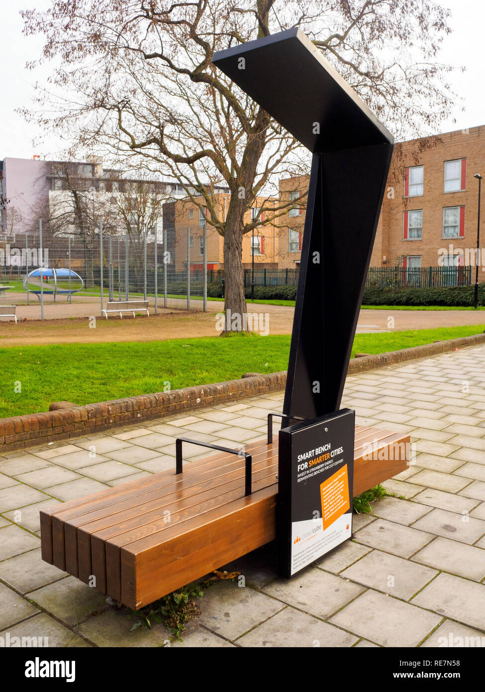 Public solar-powered 'smart bench' for charging mobile devices and wi-fi internet connection in Deptford - South East London, England Stock Photo