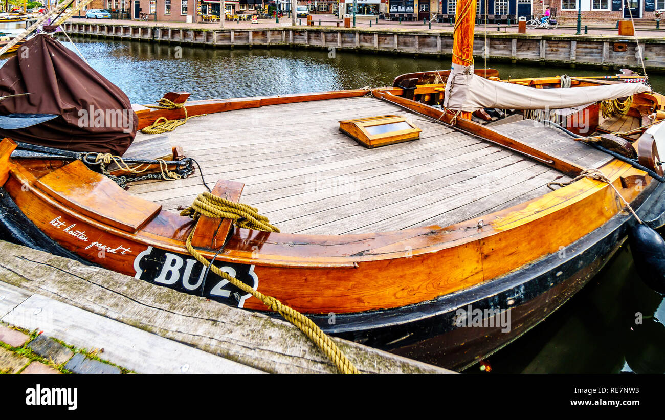 Close Up of traditional Wooden Fishing Boats, called Botters, in the harbor of the historic Dutch fishing village of Bunschoten-Spakenburg Stock Photo