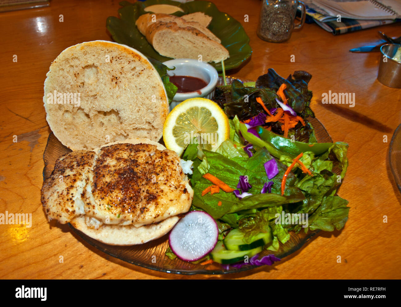 Halibut patty as burger Stock Photo Alamy
