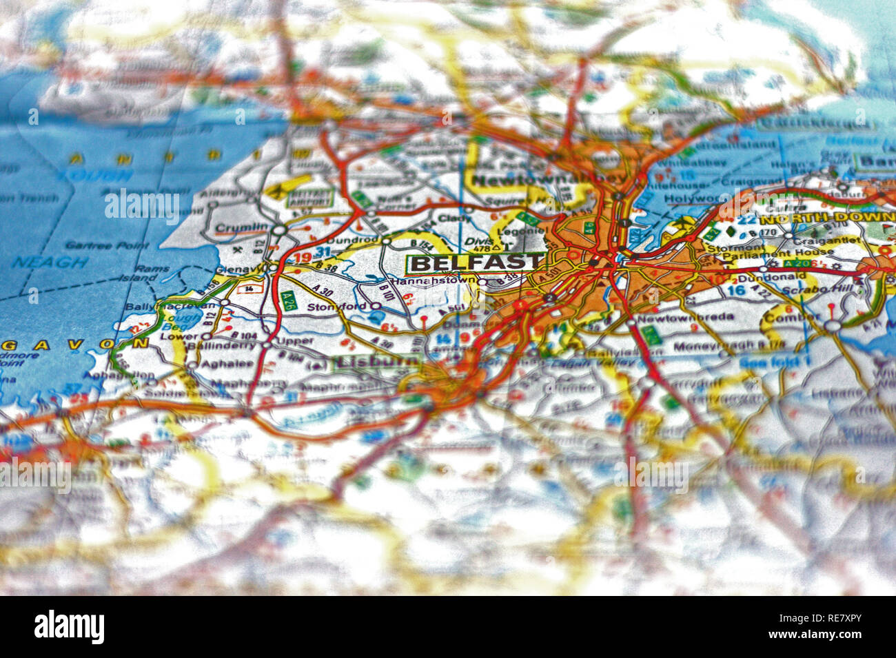 Selectively focused city of Belfast on a paper map Stock Photo