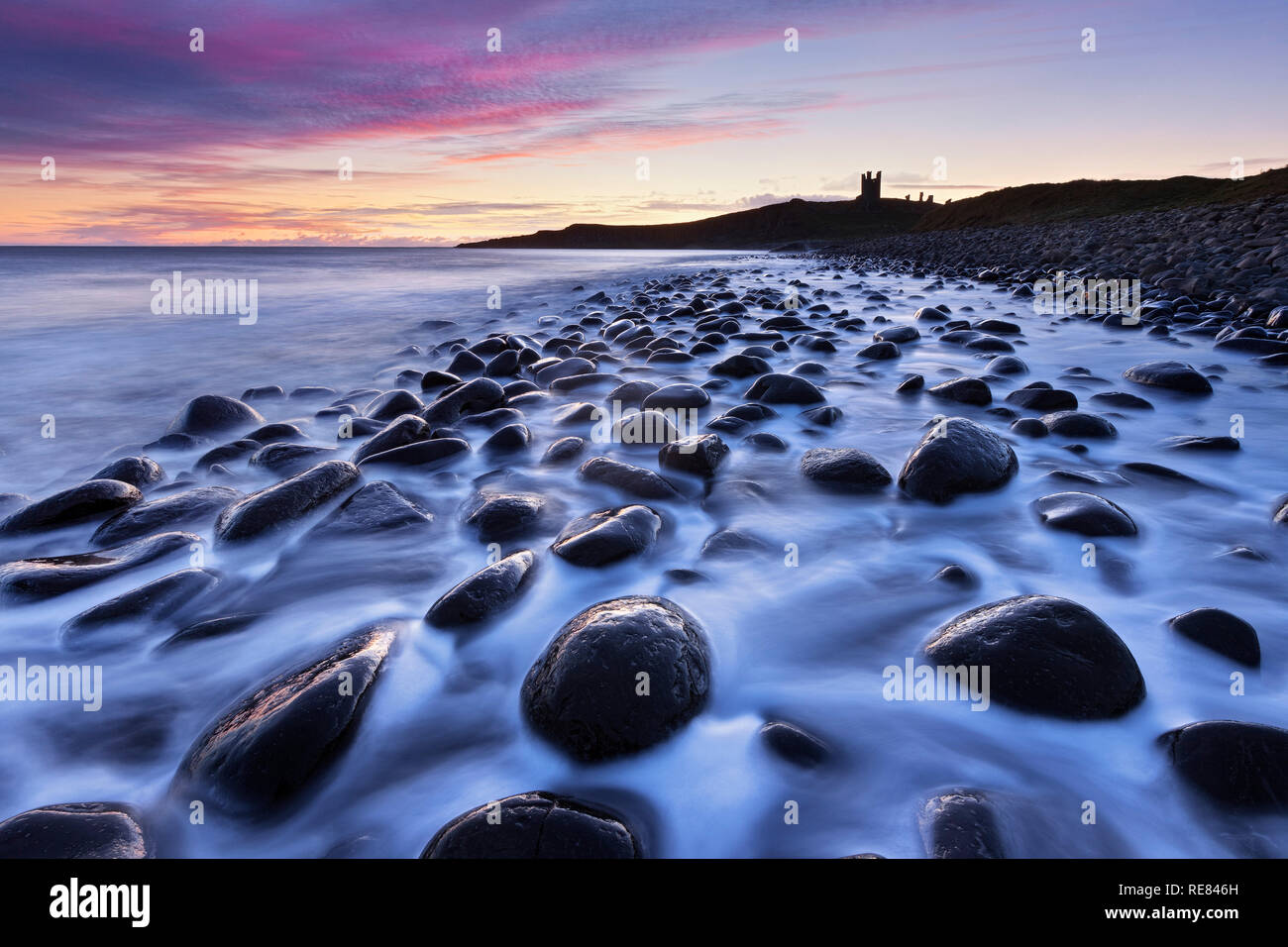 Dunstanburgh Castle and Embleton Bay, Northumberland, England Stock