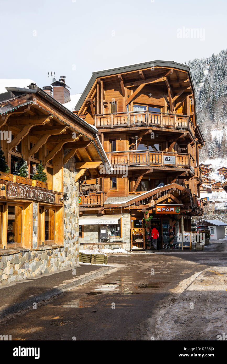 The Chalet Style Spar Shop  in the Centre of Morziine with Snow in Winter Haute Savoie Portes du Soleil France Stock Photo