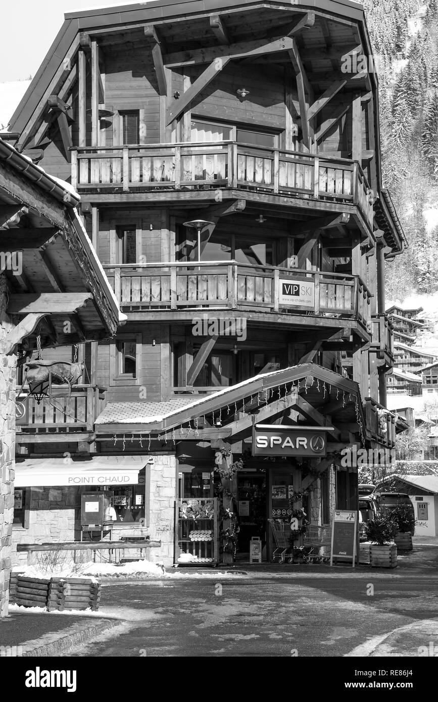 The Chalet Style Spar Shop  in the Centre of Morziine with Snow in Winter Haute Savoie Portes du Soleil France Stock Photo
