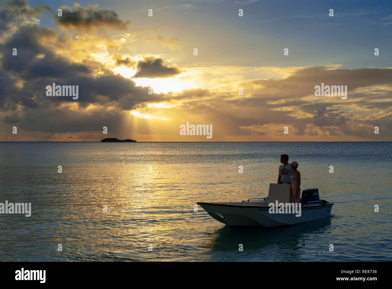 Sunset with a small boats. Beach Fernandez Bay Village, Cat Island