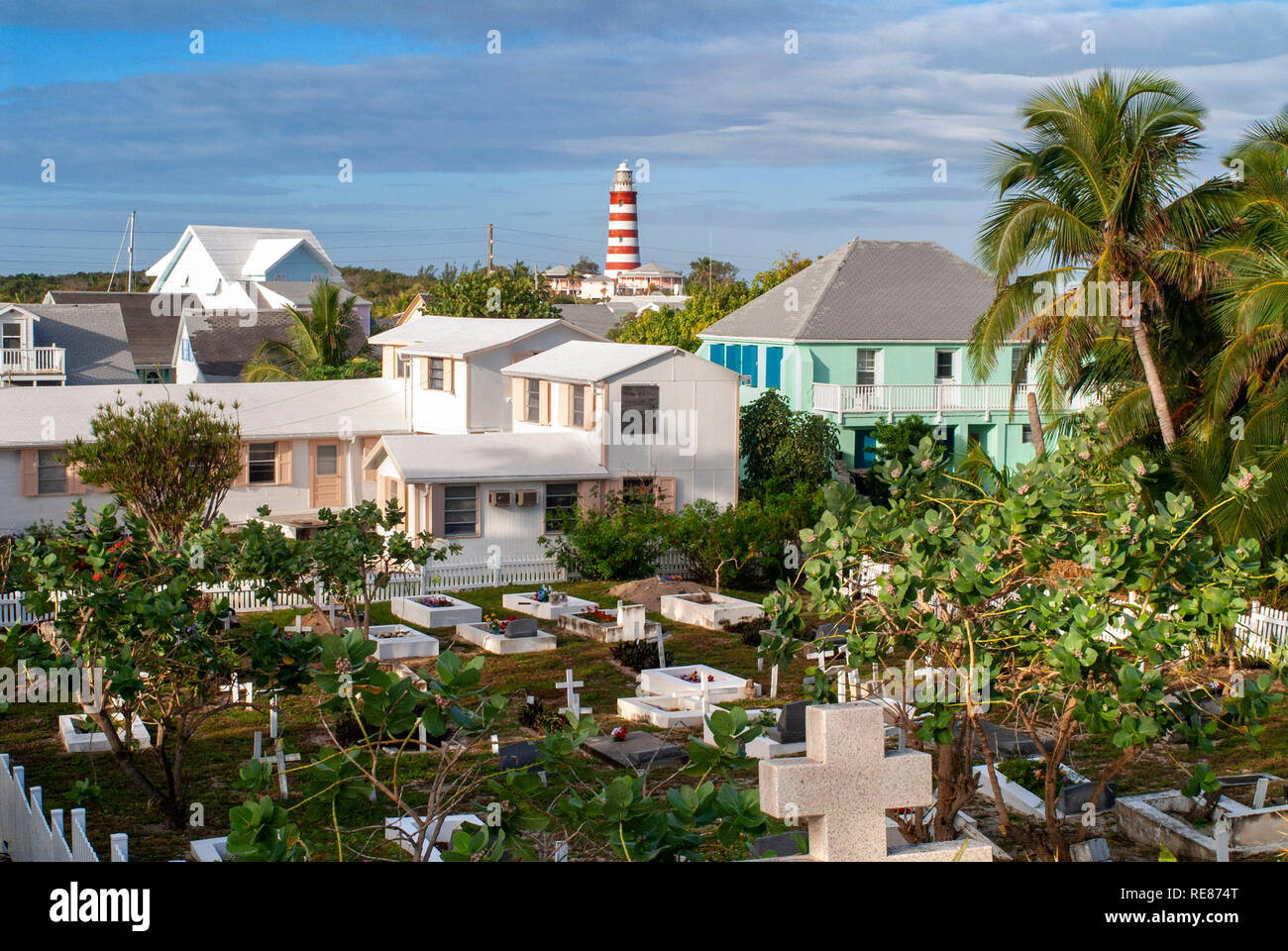 Hope Town cemetery with the lighthouse in the background, Elbow Cay, Abacos. Bahamas Stock Photo