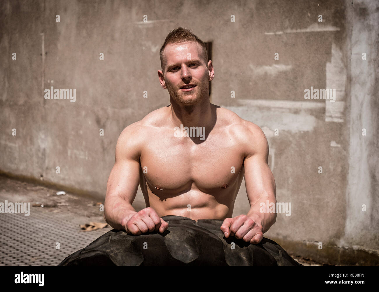 Man flipping tire hi-res stock photography and images - Alamy