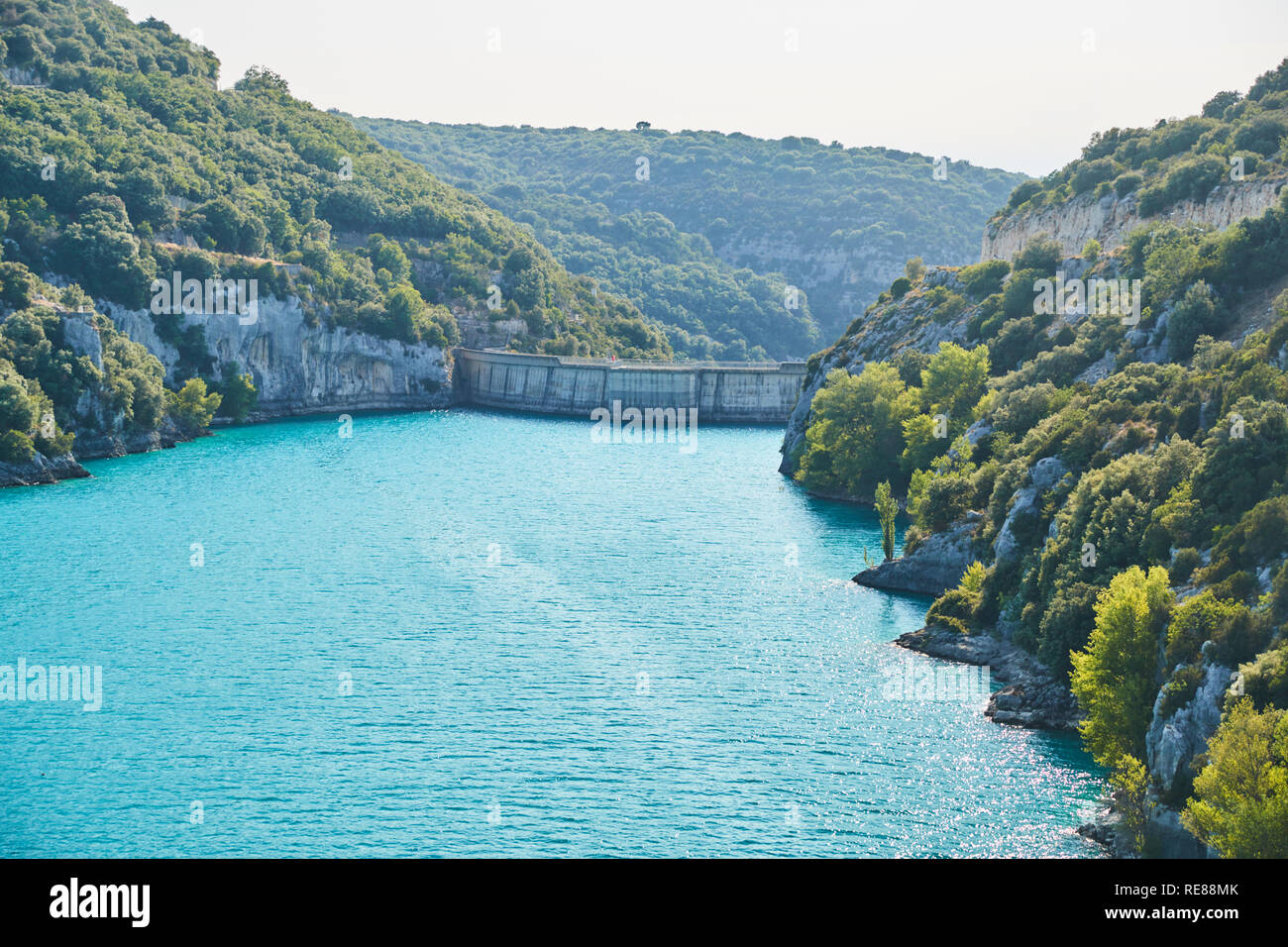 Power plant dam in France, Provence, lake Saint Cross, gorge Verdone,  azure water of the lake and slopes of mountains on a background Stock Photo