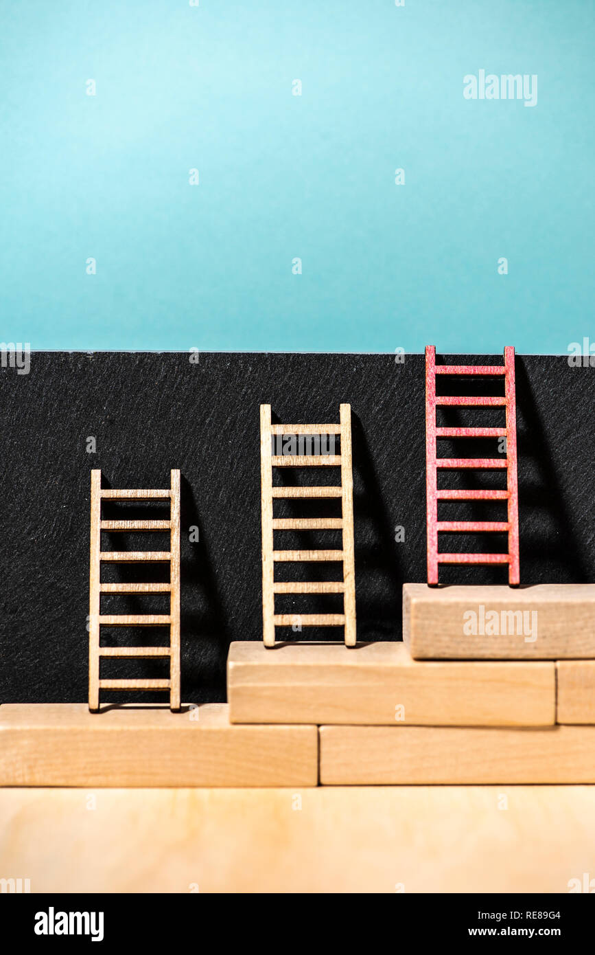 Businessman climbing up ladders hi-res stock photography and images - Alamy