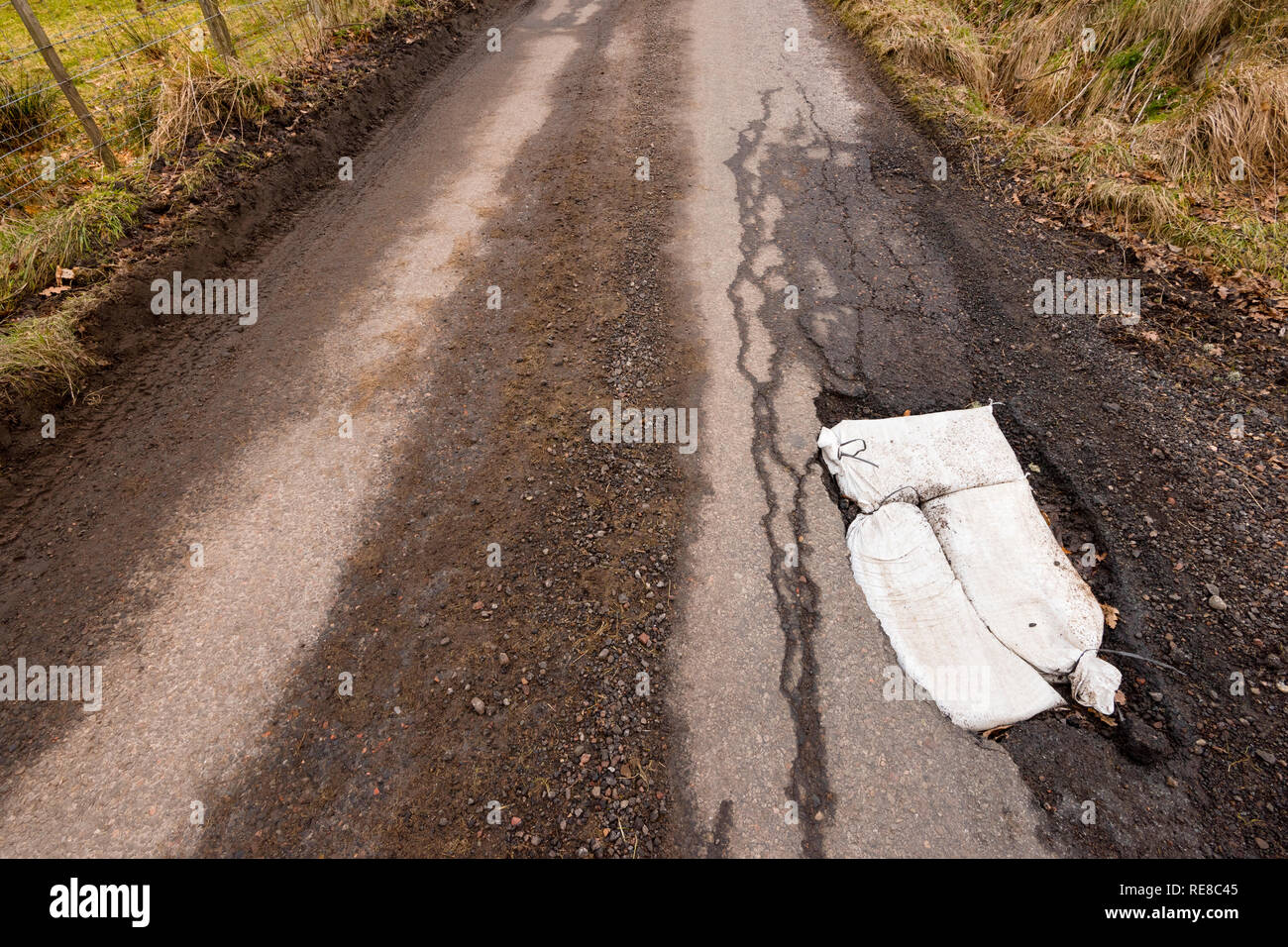 Pot Holes on single track road near Moniack, Inverness. Stock Photo