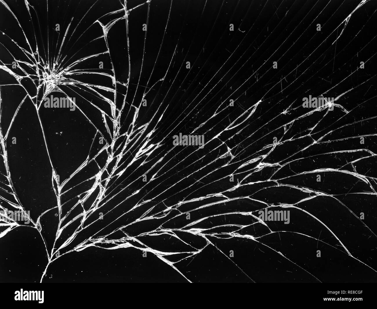 Cracked glass texture on black background. Isolated realistic cracked glass effect. Stock Photo