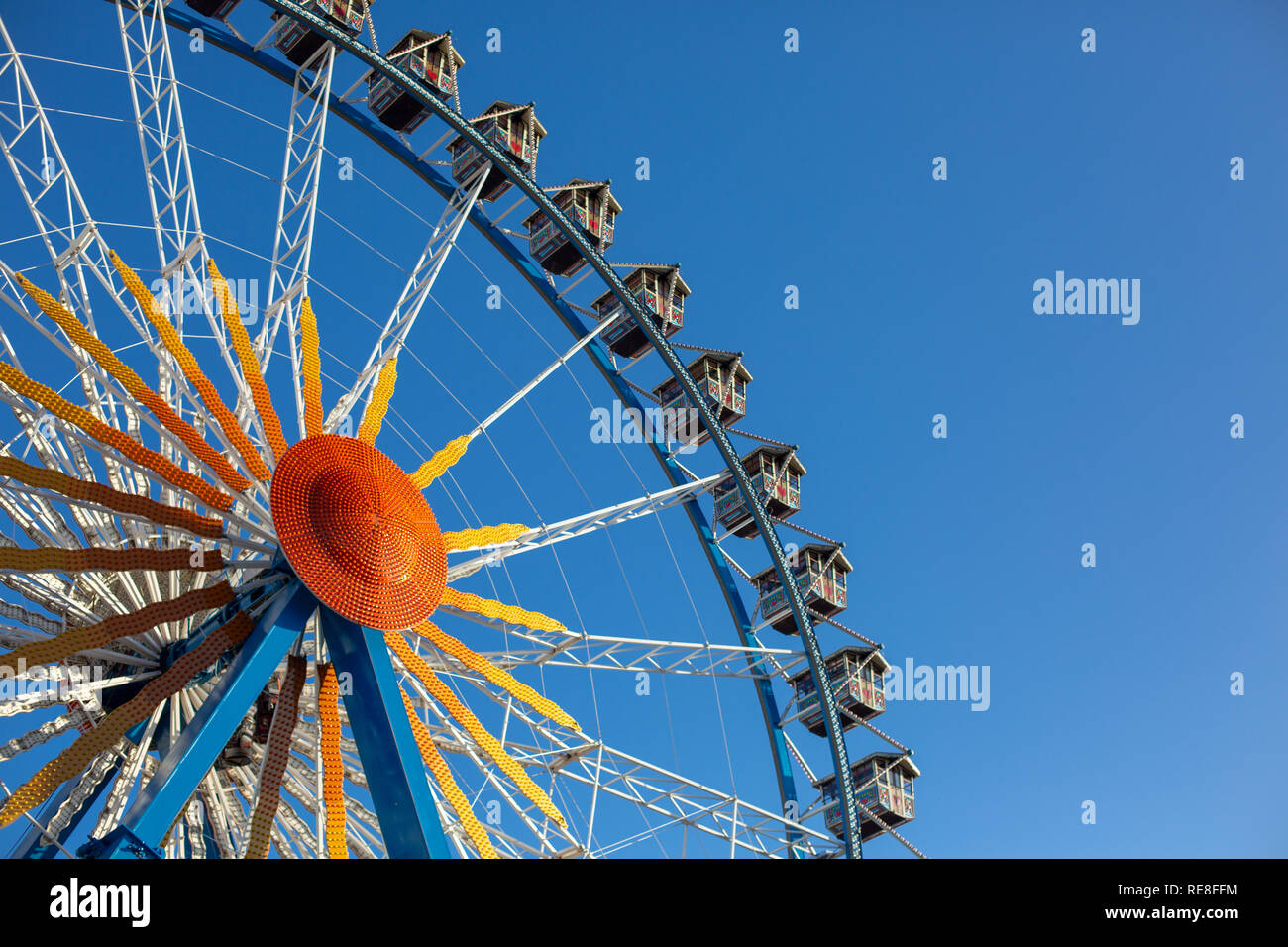 Berlin, Germany - December 5th, 2018: Ferris Wheel against the blue sky next to Rotes Rathaus. Stock Photo