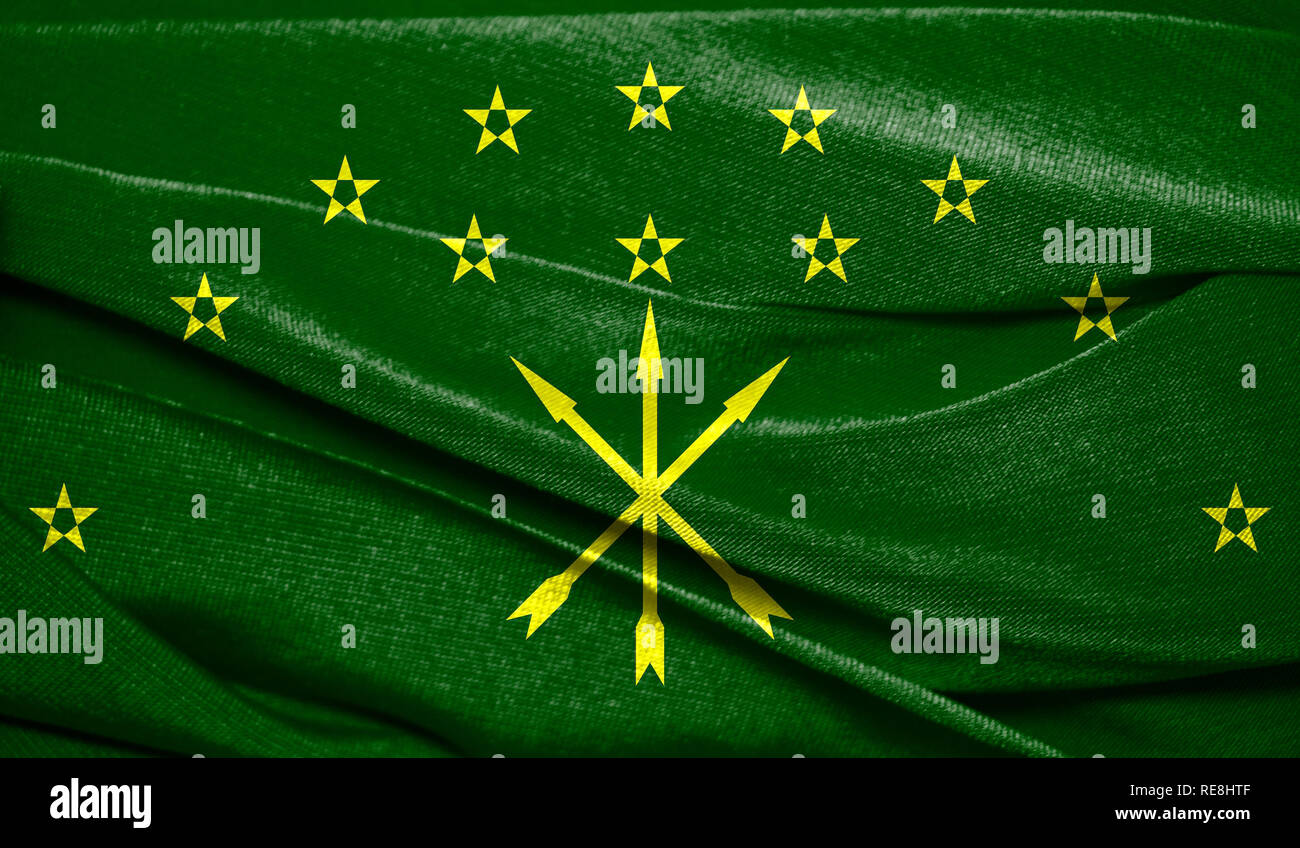 Realistic flag of Adygea on the wavy surface of fabric. Perfect for background or texture purposes. Stock Photo