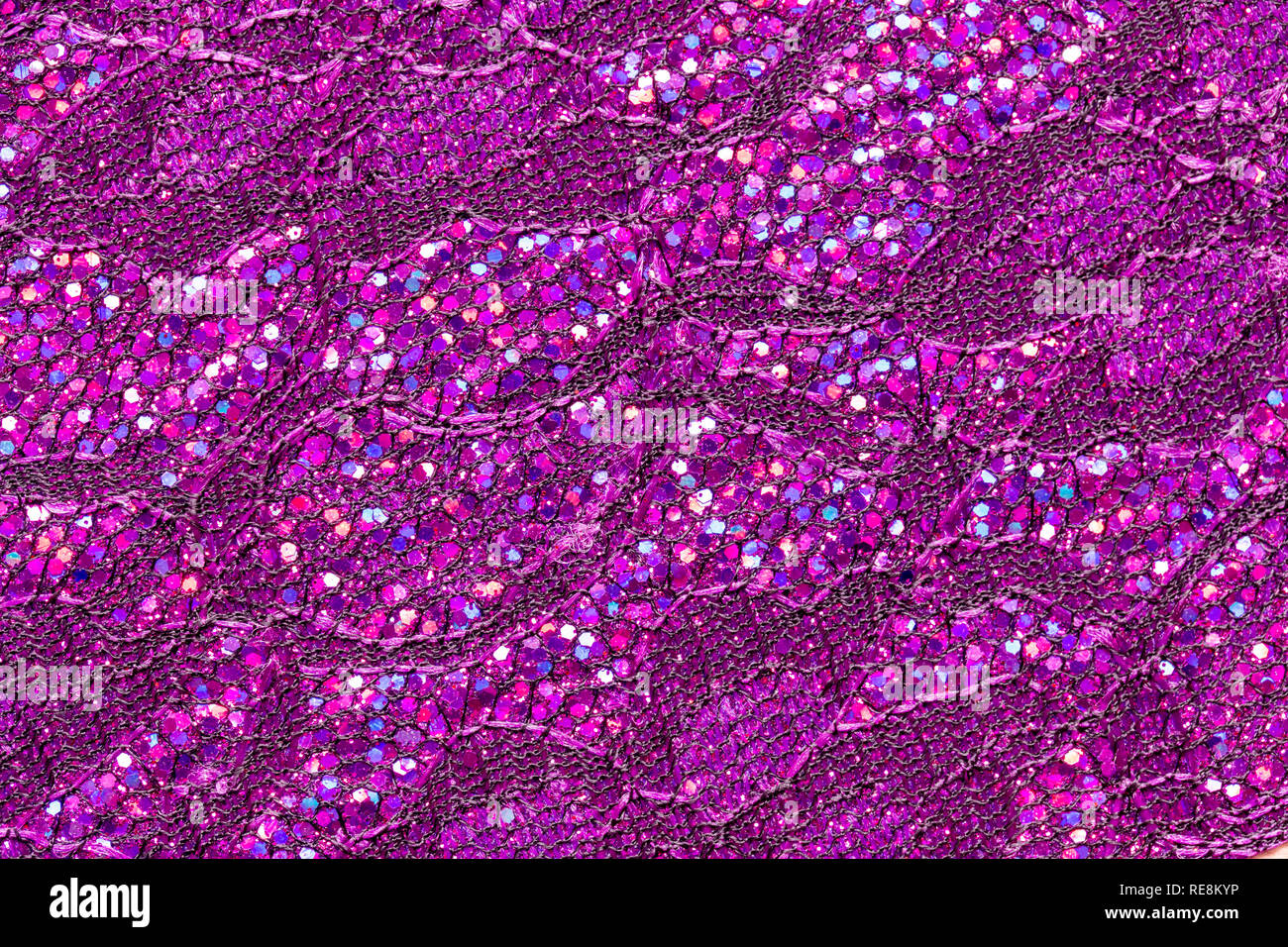 Abstract textured background of pink sequins and lace Stock Photo