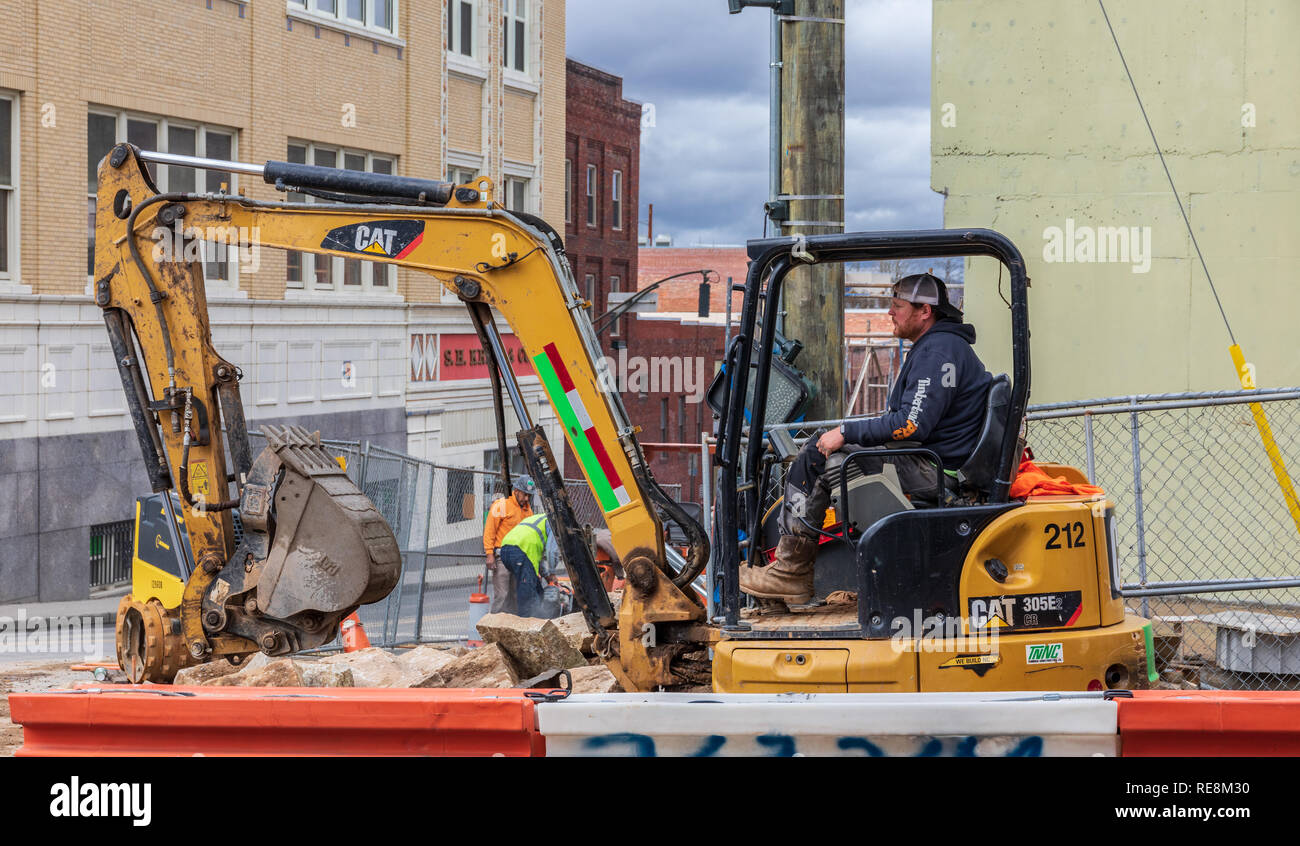 Asheville Nc Usa 1 18 19 A Heavy Equipment Operator Handles A Cat 305e Backhoe Stock Photo Alamy