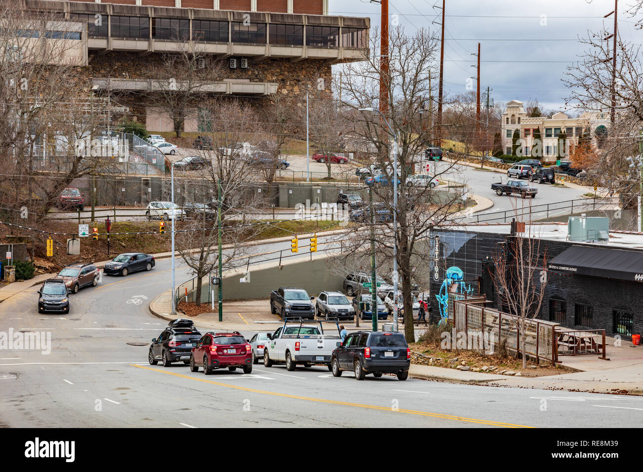ASHEVILLE, NC, USA-1/18/19: An S-curve of Hiawassee St., climbing the hill to intersect Flint and Haywood, in downtown.  The US Cellular Center, a lar Stock Photo