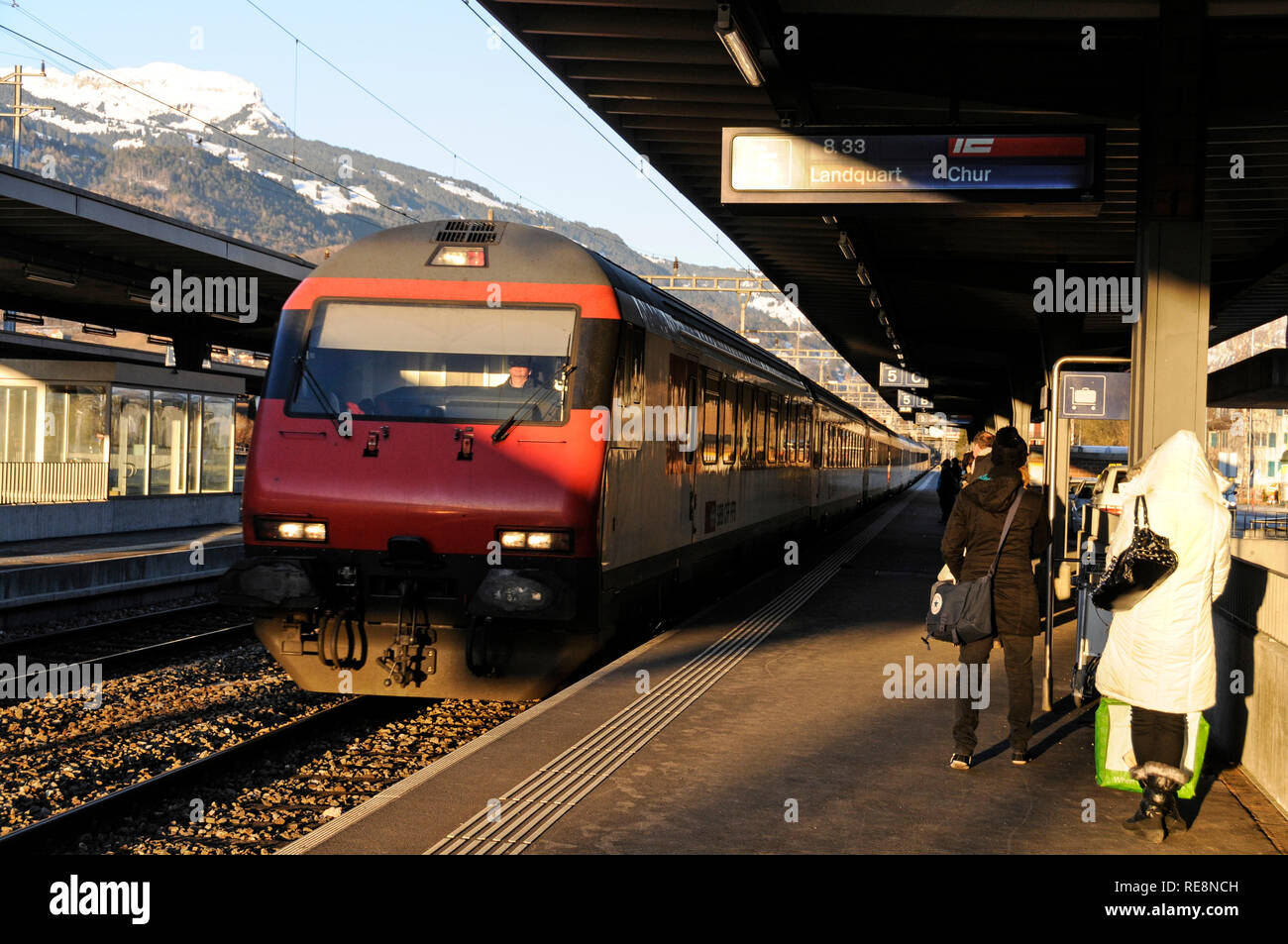 An A Swiss Inter-City express train pulls in at Landquart en route to Chur Stock Photo