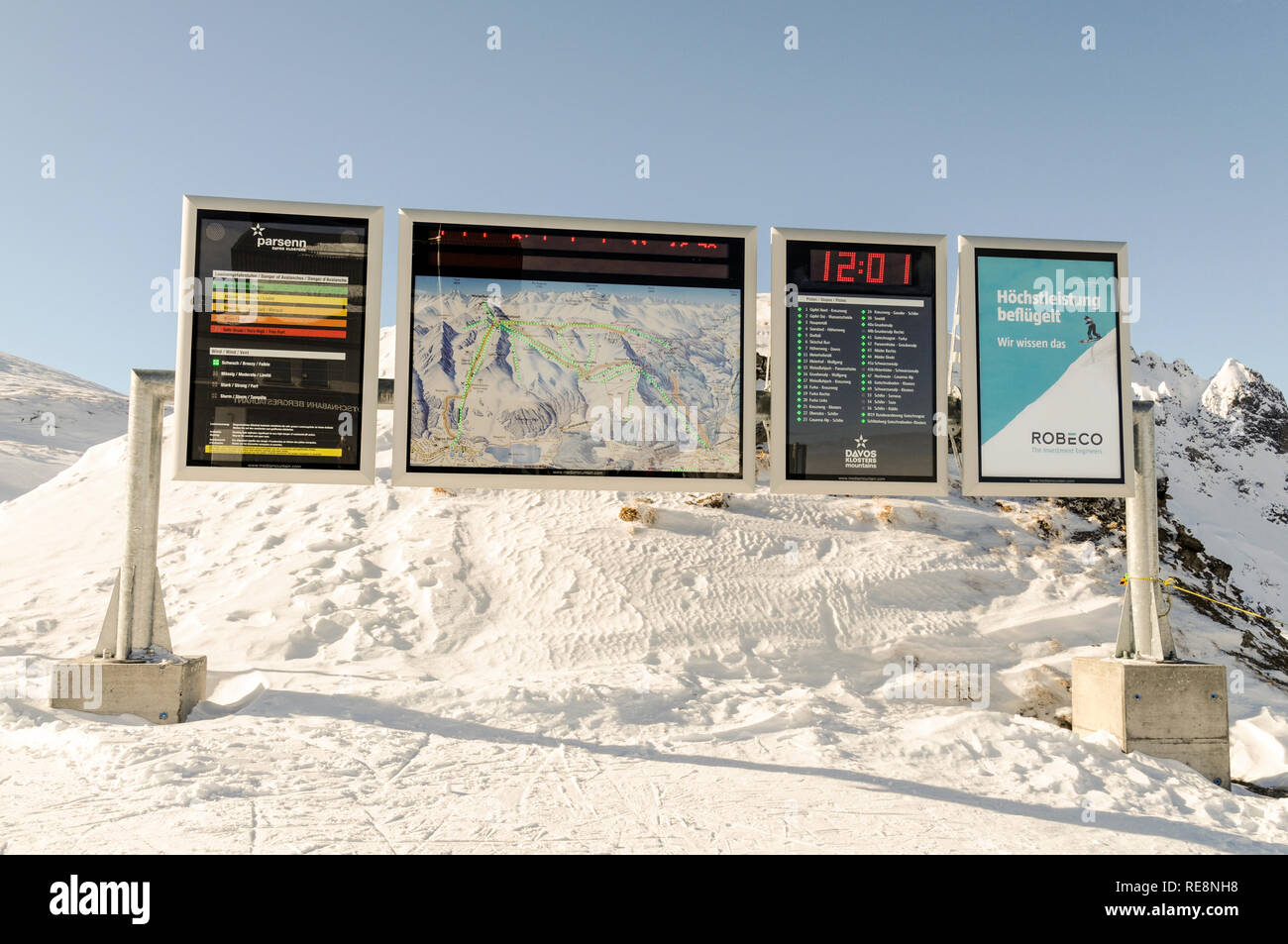 An electronic information board  displaying safe local ski routes, weather updates and local temperature at Gotschna Pasrsenn mountain summit  above K Stock Photo