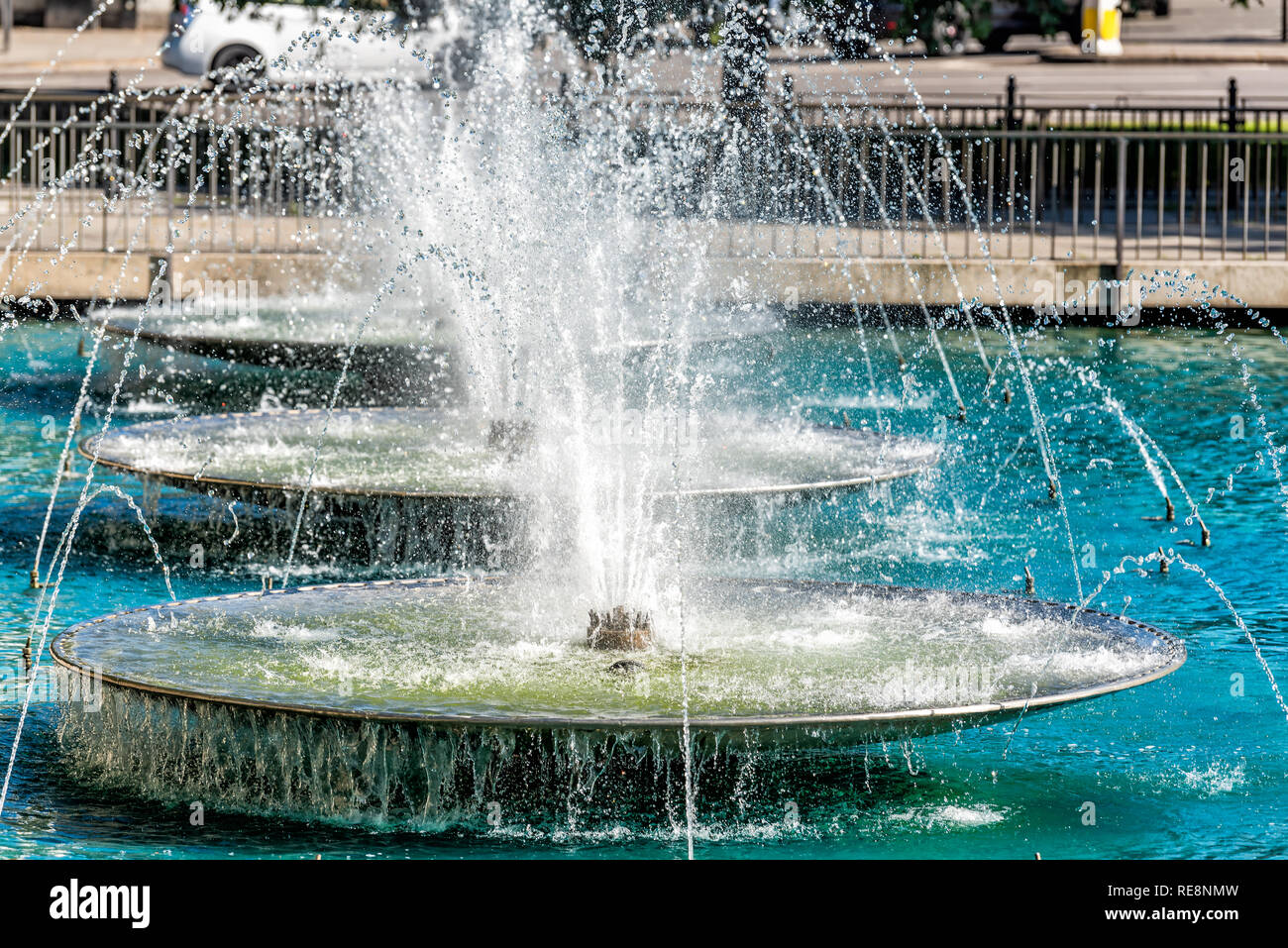 Row of three water fountain closeup with nobody architecture in London, UK street park with spraying drop jets Stock Photo