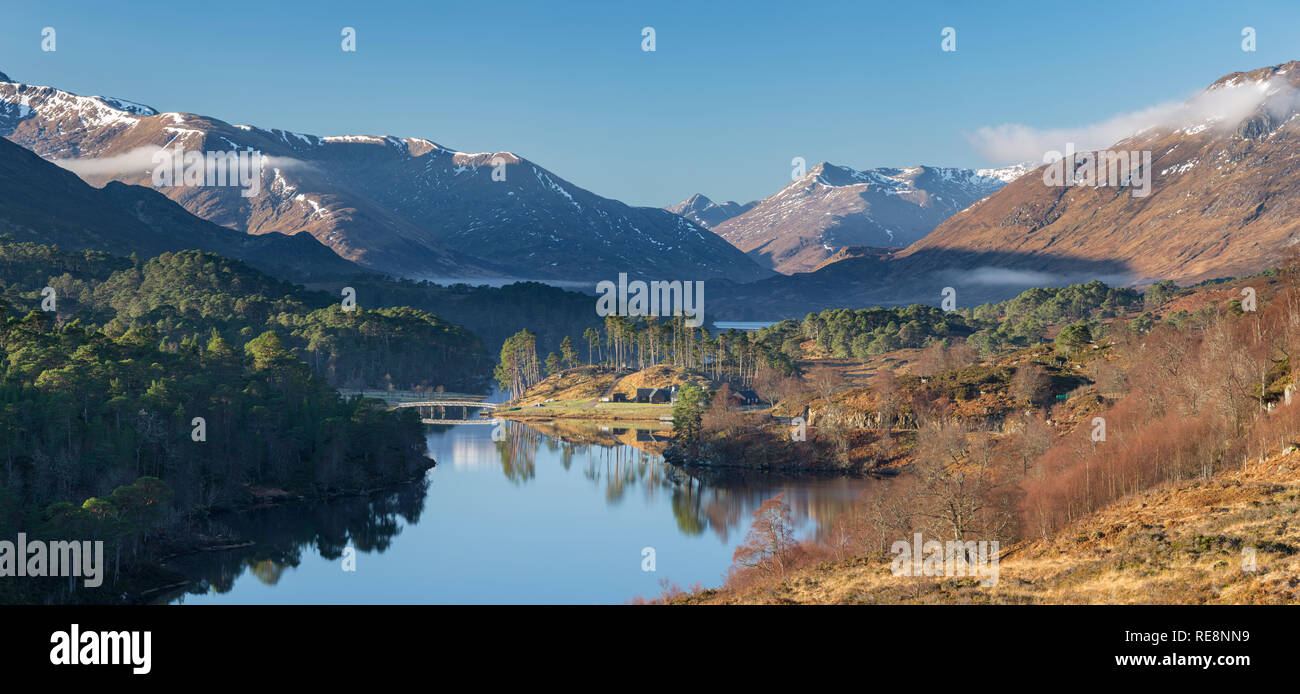 Looking west towards Loch Affric and the surrounding mountains with Affric Lodge ancillery buildings in the centre. Stock Photo