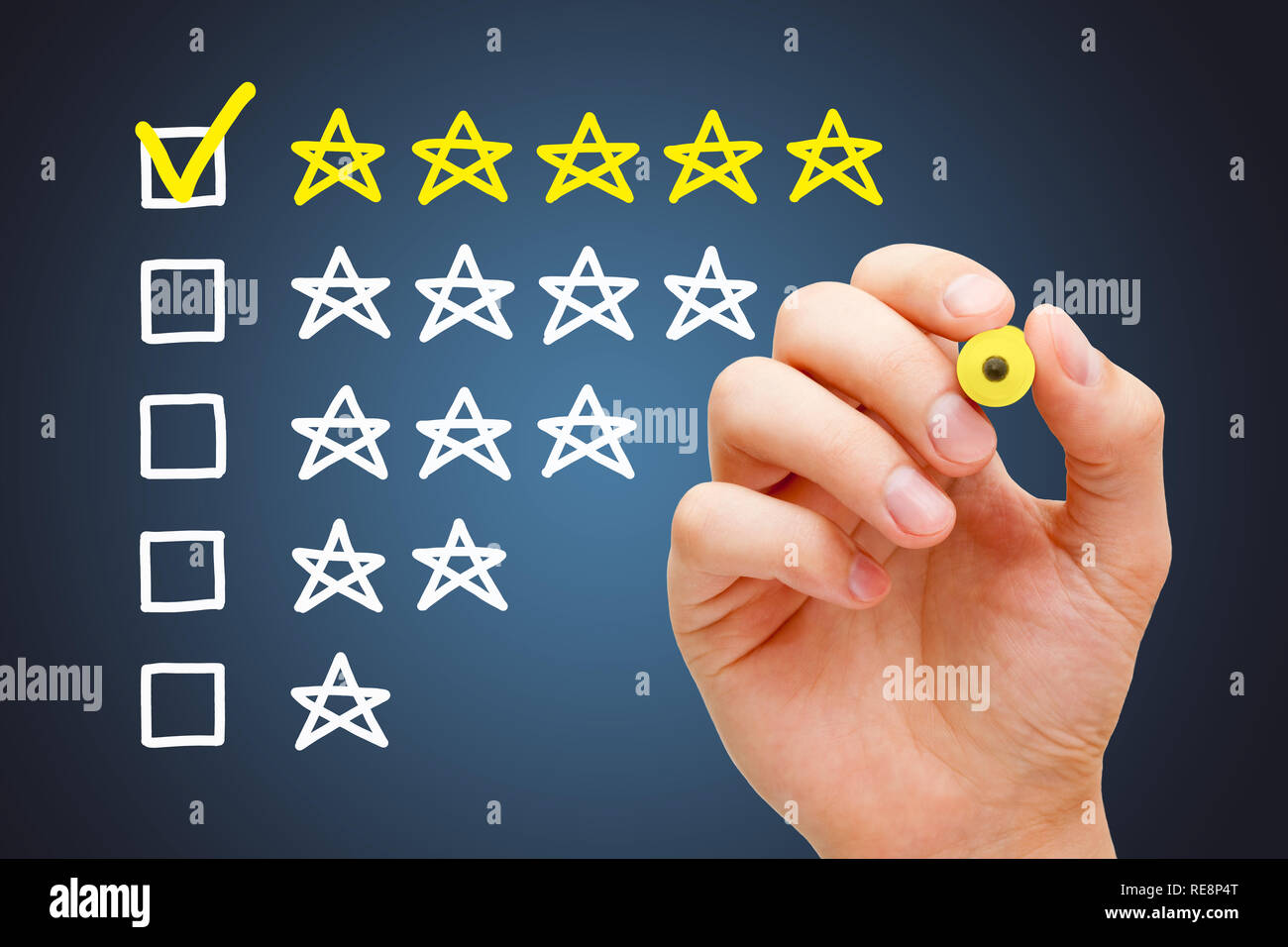 Satisfied customer putting yellow check mark with marker on five star in evaluation form. Stock Photo