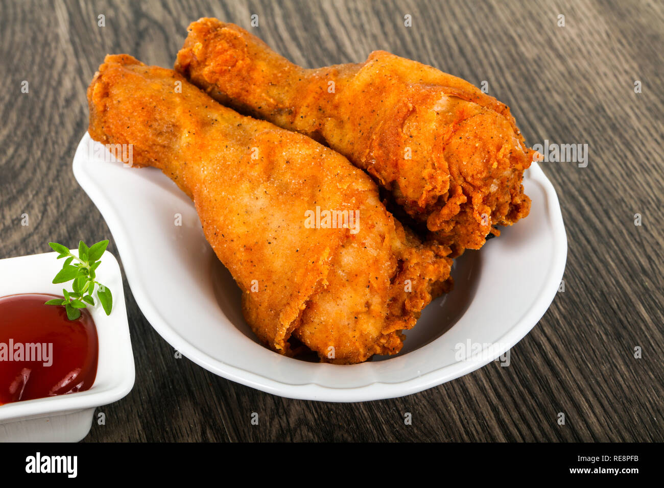 Crispy chicken legs with ketchup Stock Photo Alamy