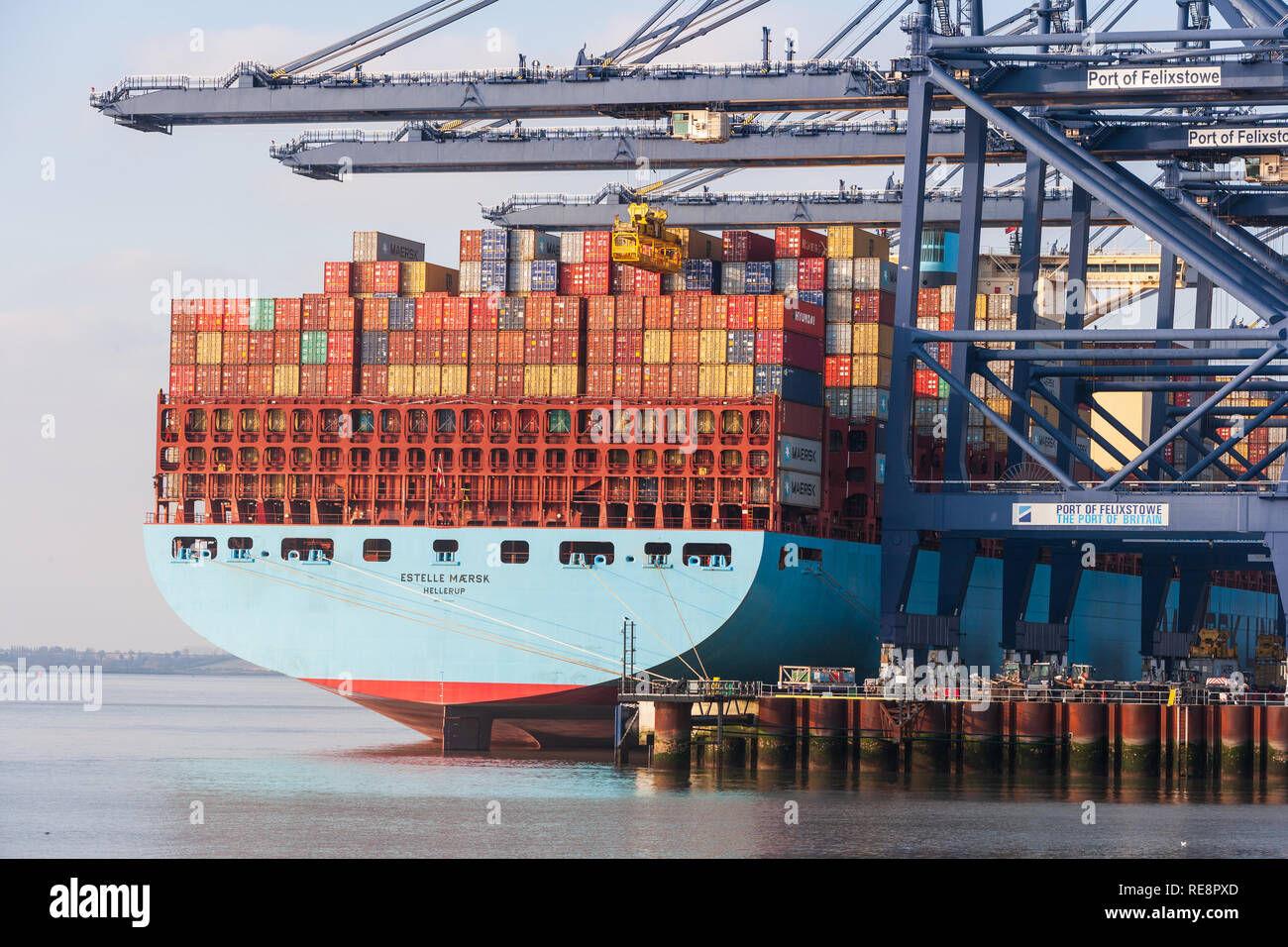 view of massive maersk container ship unloading containers freight at ...